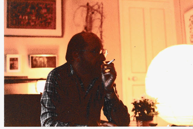 Charles Self seen smoking a cigarette.