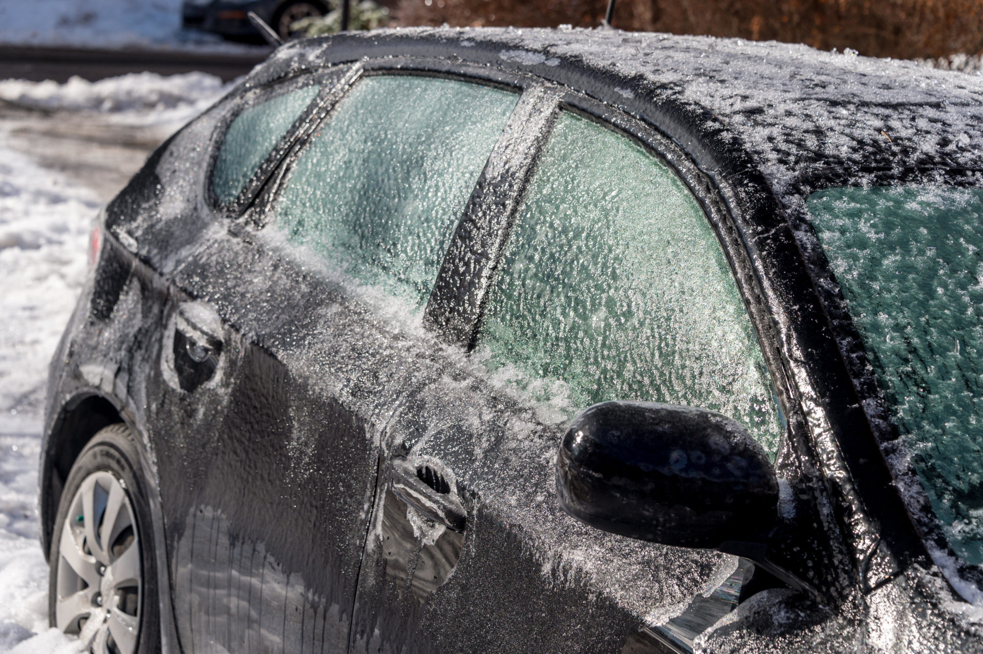 Thick layer of ice covering car after freezing rain Canada. Image: Marc Bruxelle / Alamy