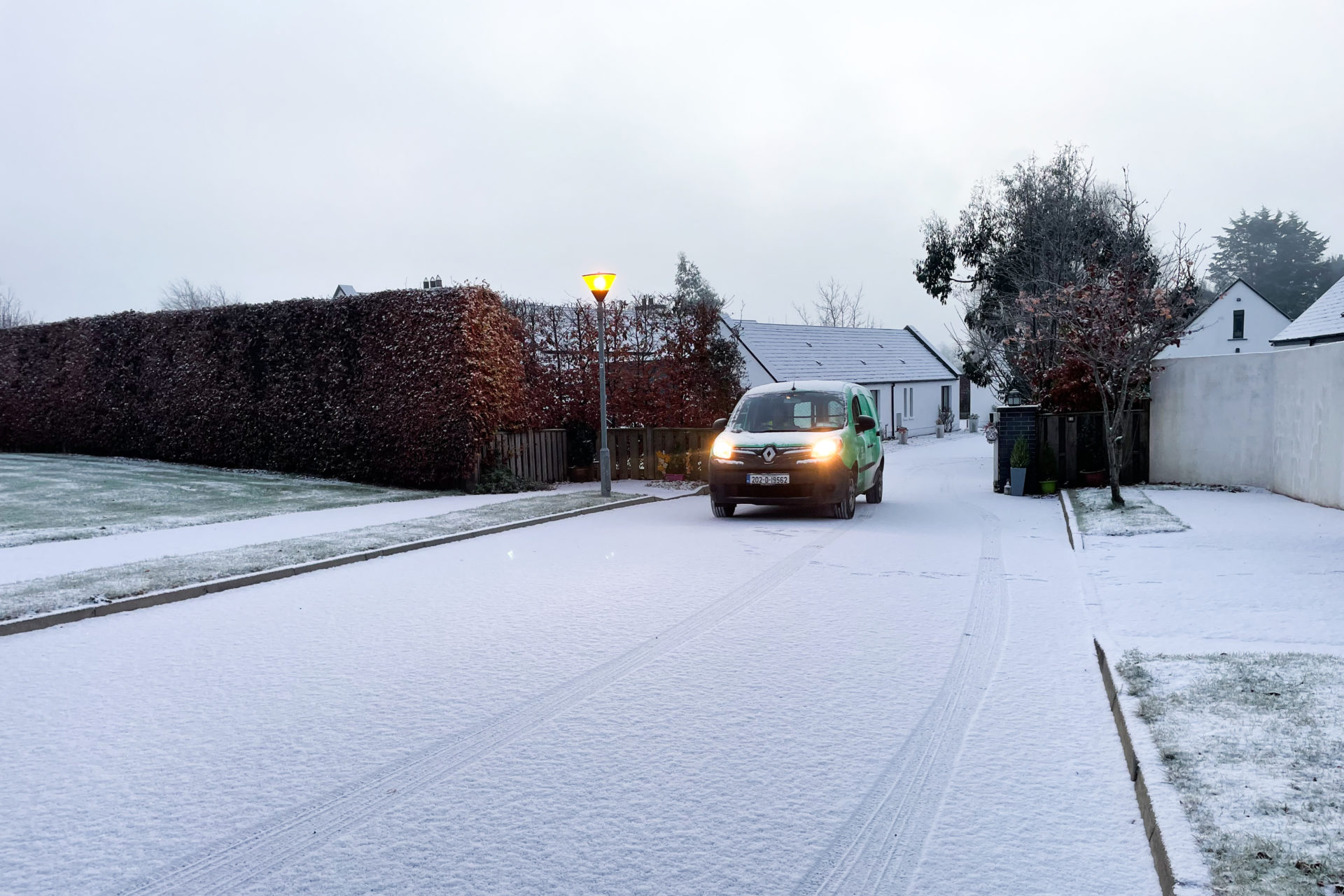 The postman arrives amid snow and freezing fog on an estate near Newbridge in County Kildare, 09-12-2022. Image: Eamonn Farrell/RollingNews