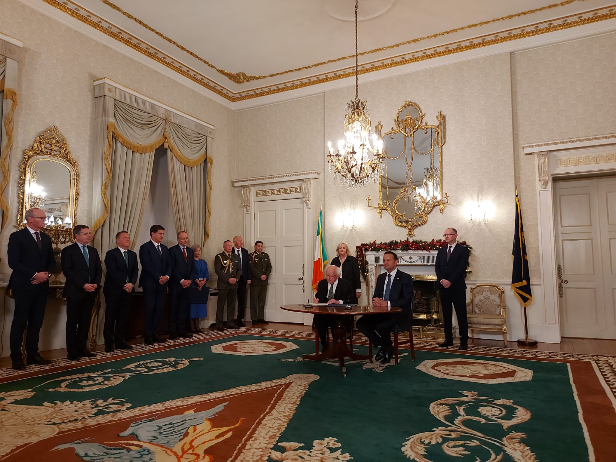 President Michael D Higgins (seated left) and Taoiseach Leo Varadkar (seated right) prepare to hand out seals of office to the Cabinet (standing left) at Áras an Uachtaráin