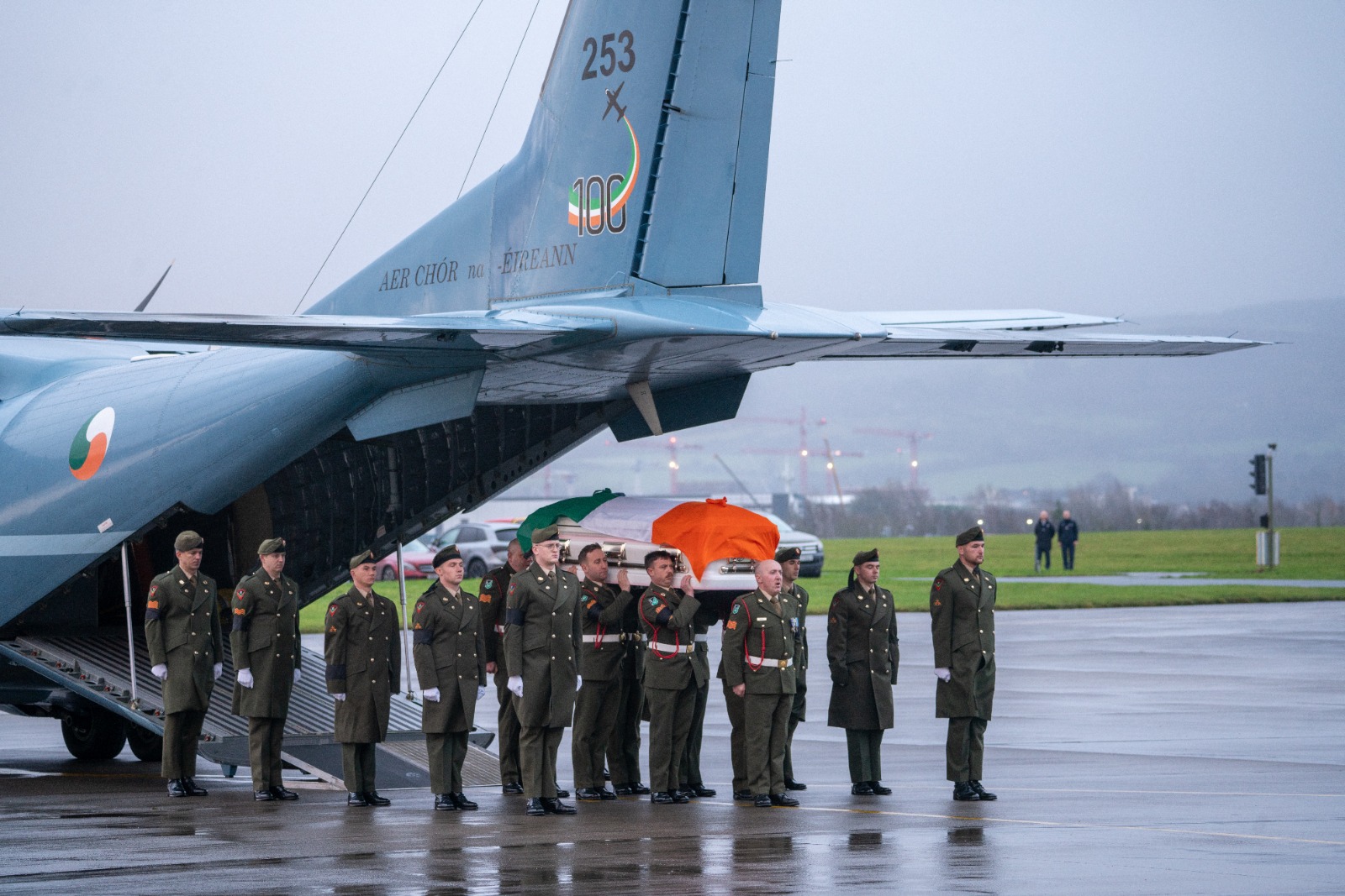 The remains of Private Seán Rooney are carried off the plane at Casement Aerodrome in Dublin, 19-12-2022. Image: Tom Douglas/Newstalk