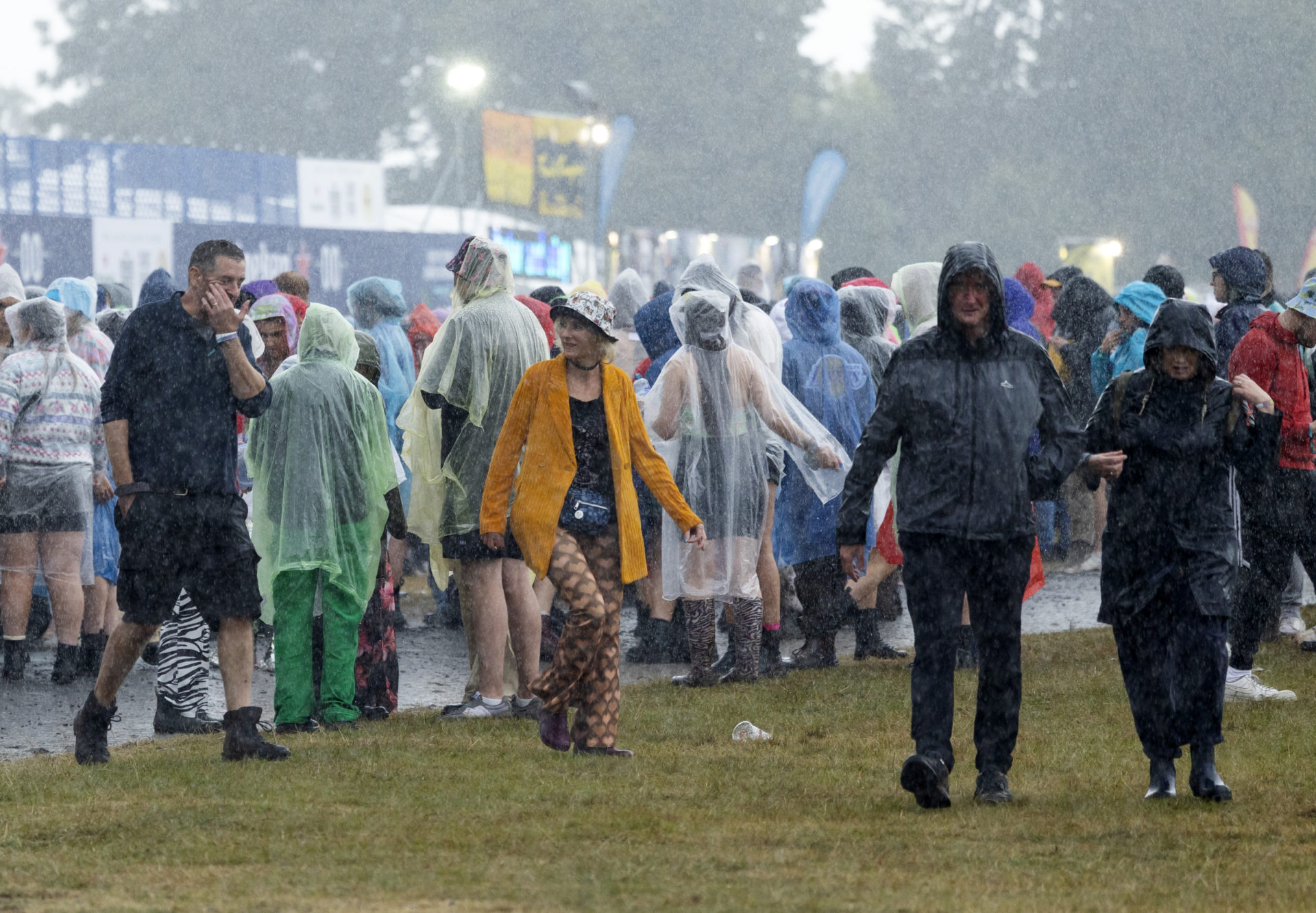 Fans wearing plastic raincoats to protect themselves from the rainy weather at Electric Picnic