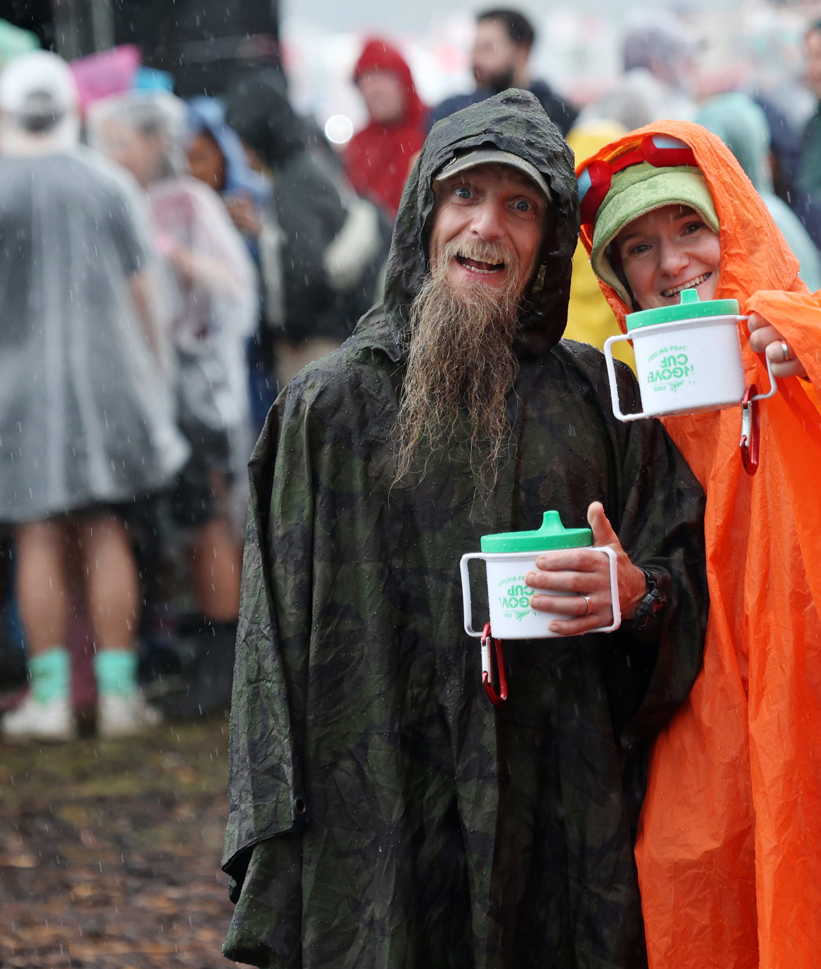 Fans wearing plastic raincoats to protect themselves from the rainy weather at Electric Picnic