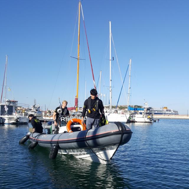 Seán Binder is seen on a rescue boat