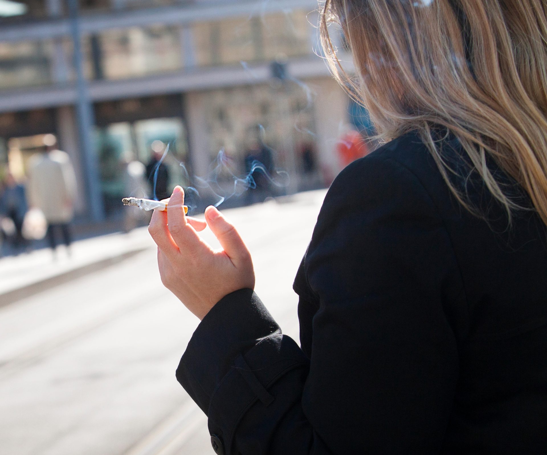 File photo shows a woman smoking.