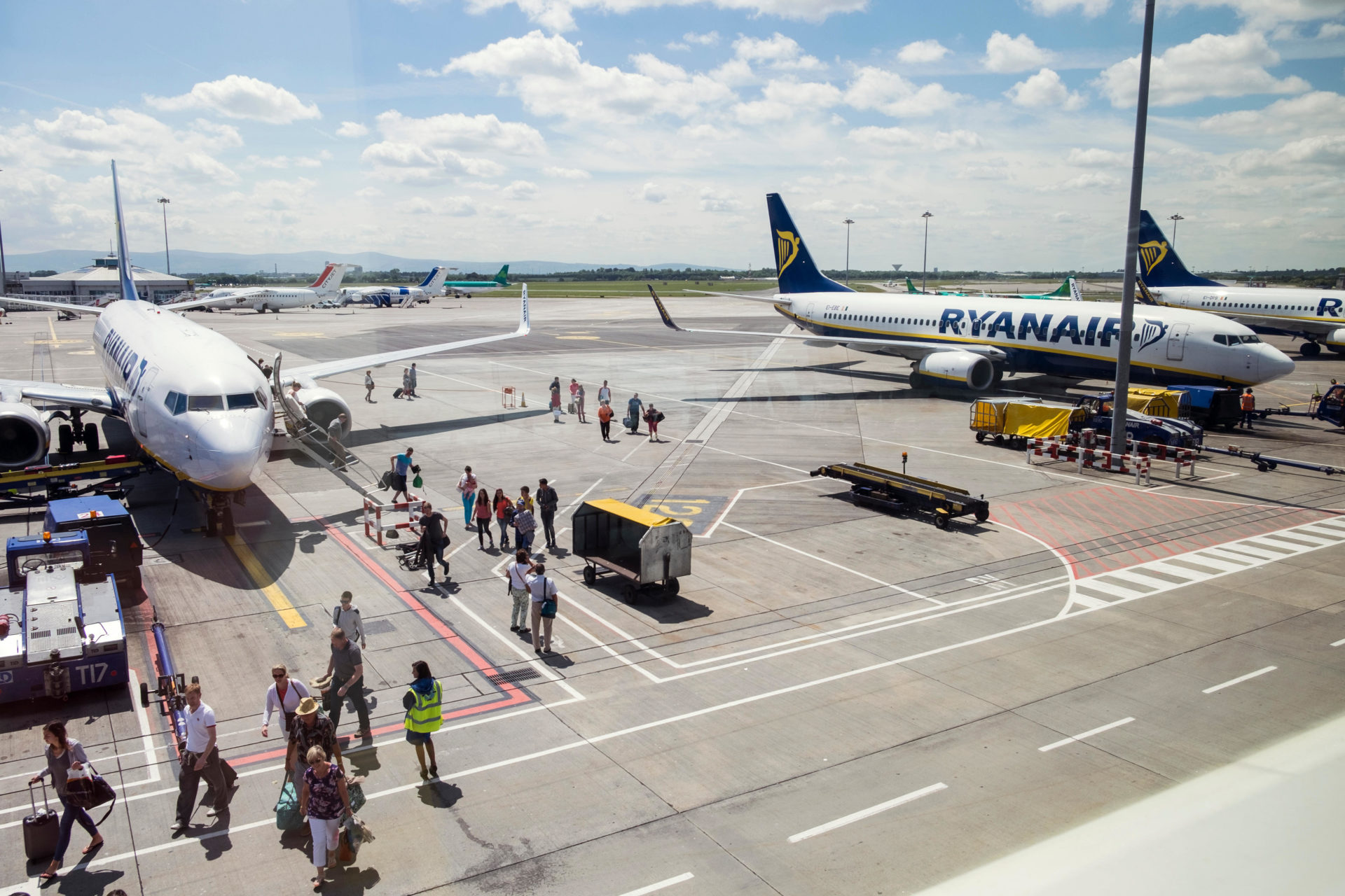 Passengers disembark from planes at Dublin Airport.