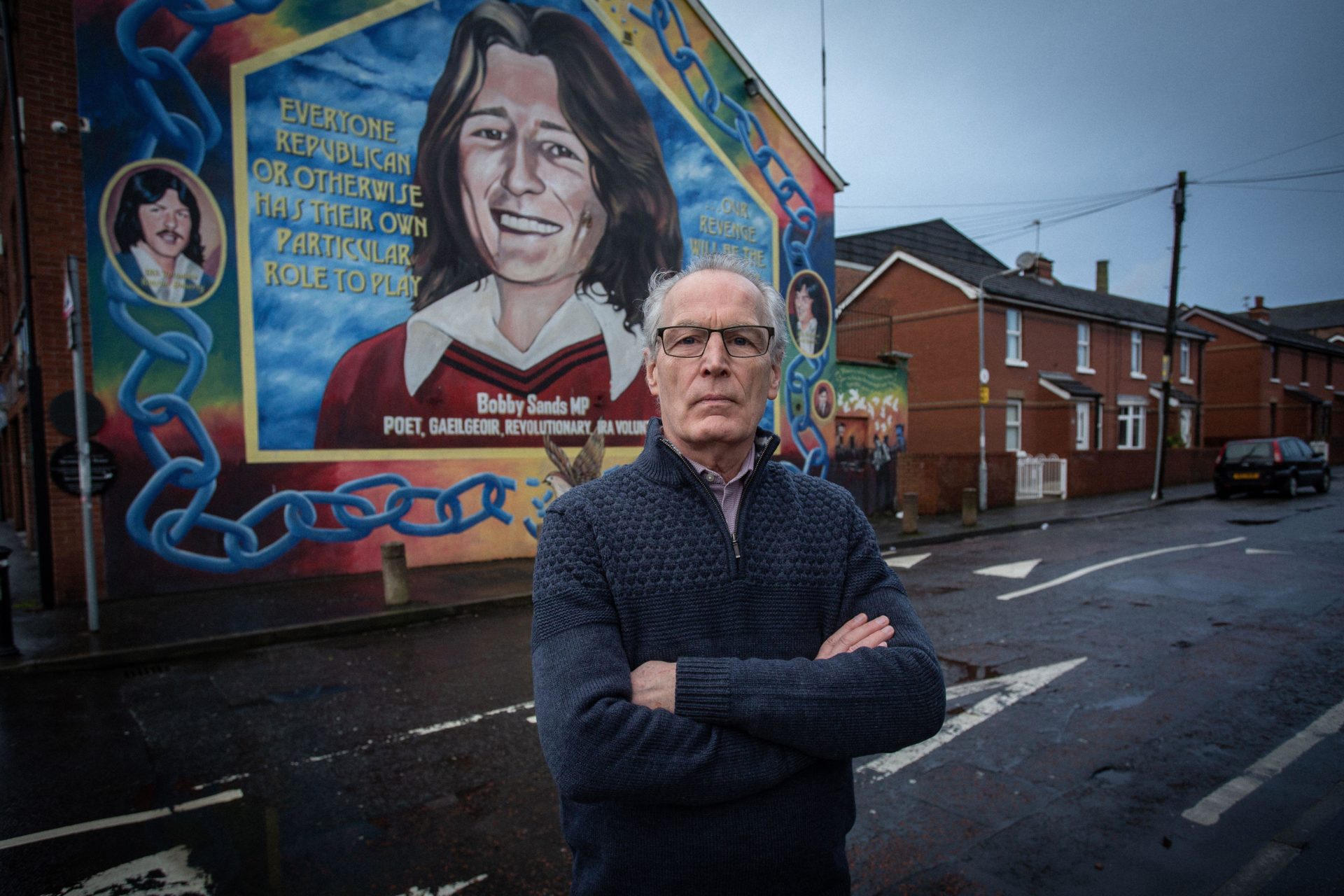 Gerry Kelly stands in front of the Bobby Sands mural in Belfast, Northern Ireland in February 2021