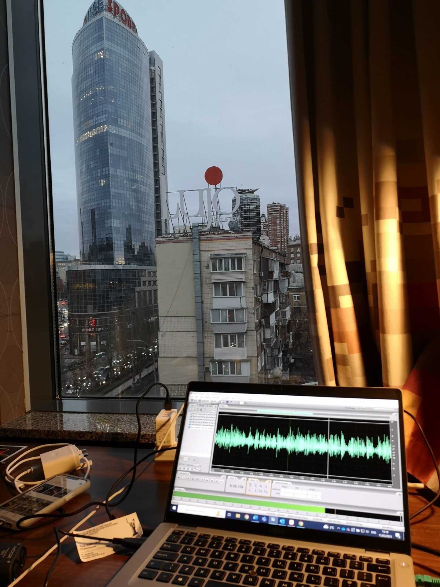 Editing while looking out towards the Kyiv skyline.