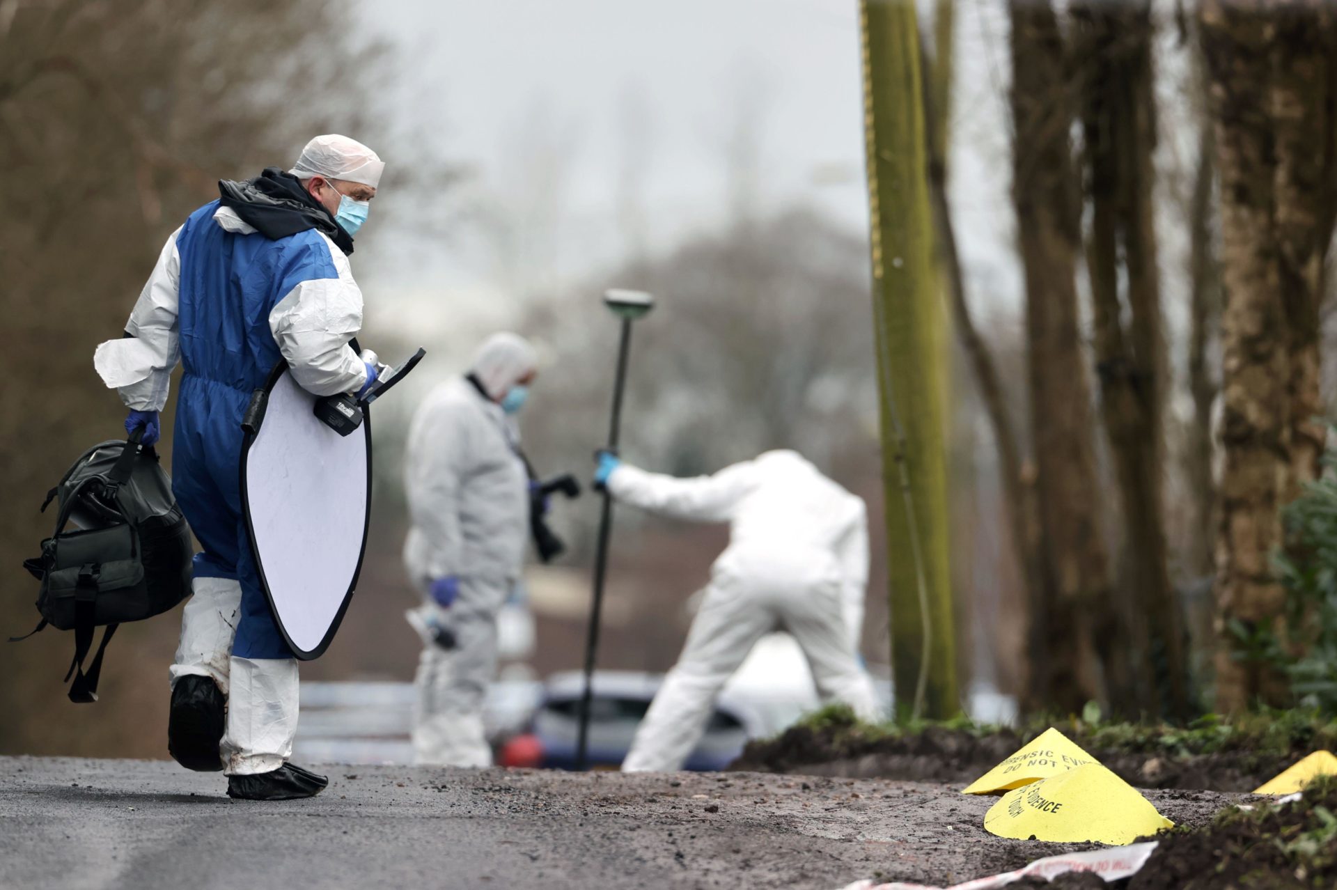 Forensic officers at the scene near the sports complex near Omagh, Co Tyrone, where off-duty PSNI Detective Chief Inspector John Caldwell was shot.