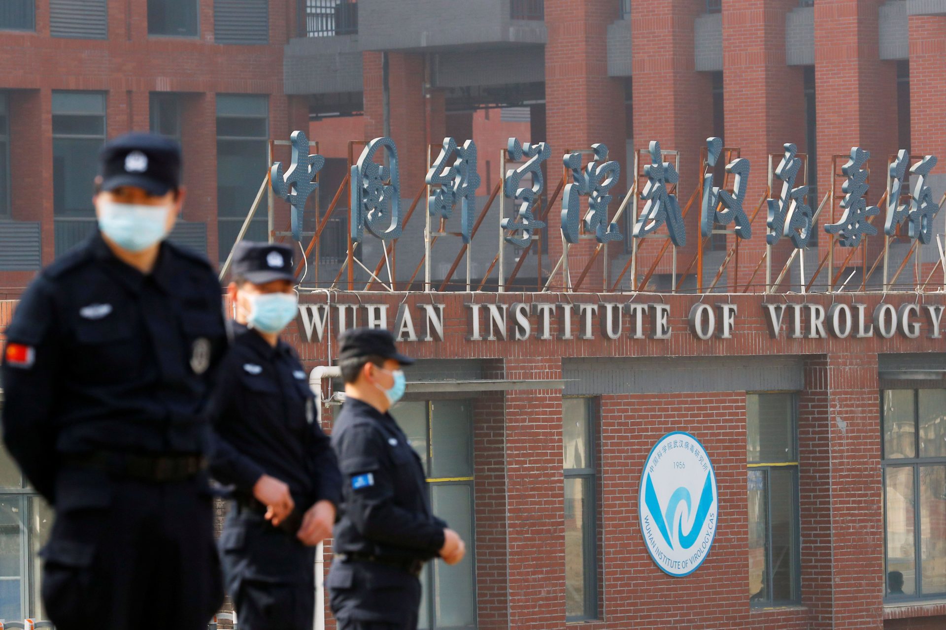 Security personnel outside the Wuhan Institute of Virology during the visit by the World Health Organization (WHO) investigative team, 03-02-2021. Image: REUTERS/Thomas Peter