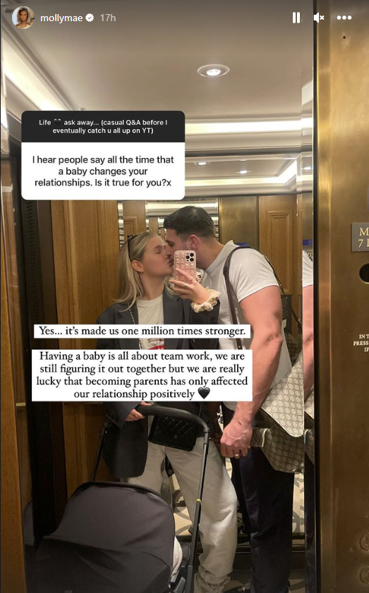 Tommy Fury kisses Molly-Mae as she takes a picture of them in the mirror of a lift