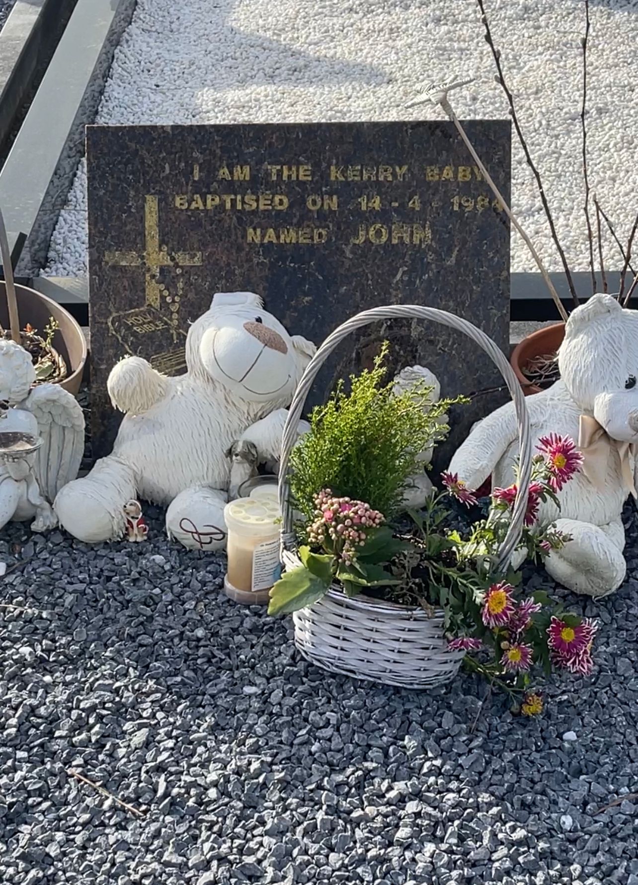 The grave of Baby John in Co Kerry where there are flowers and toys laid for him.