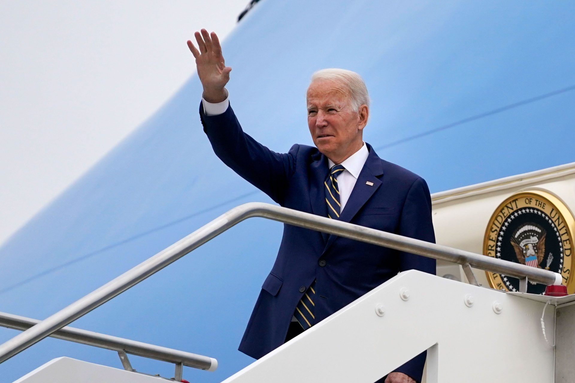 US President Joe Biden waves as he boards Air Force One after attending a G20 summit in Rome, Italy in November 2021.
