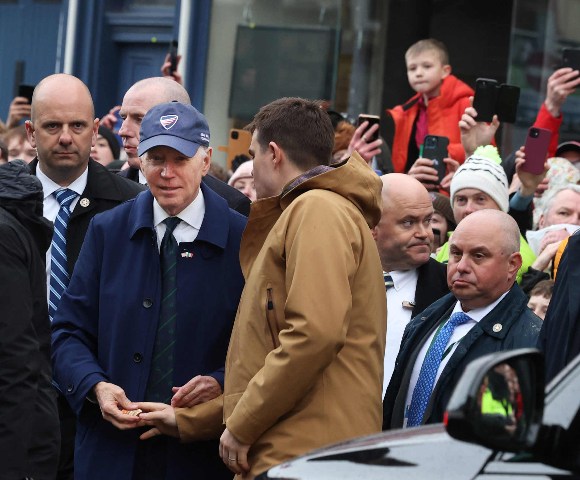 US President Joe Biden is surrounded by Secret Service officers during his visit to Dundalk
