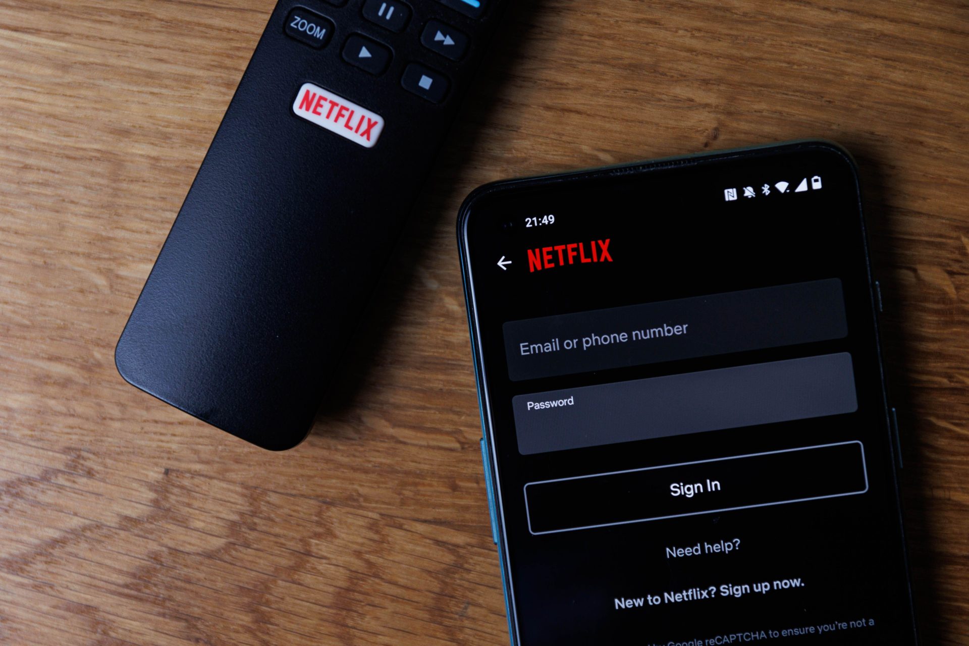 A Netflix login screen is seen on on a smartphone display