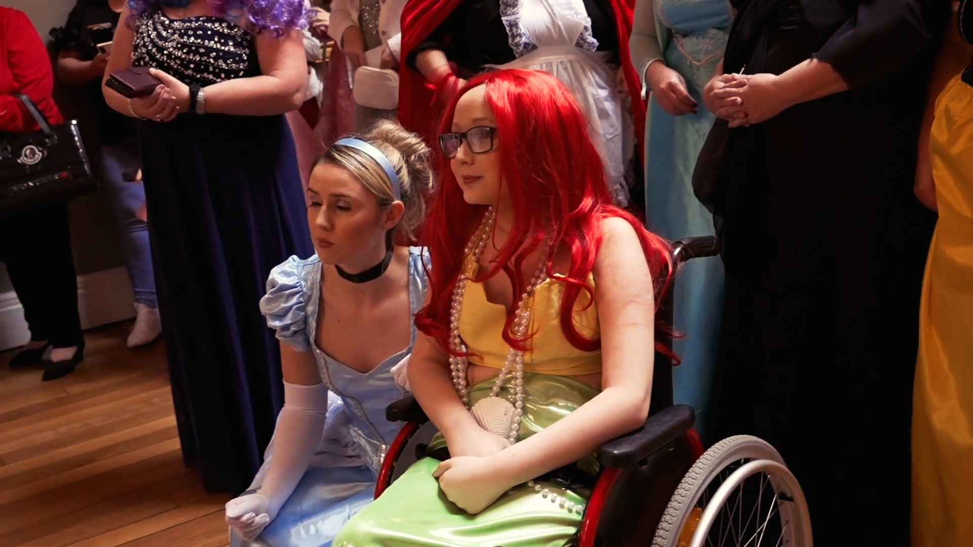 Jacob Perkins, dressed as Ariel, alongside Cinderella at his Make-A-Wish party