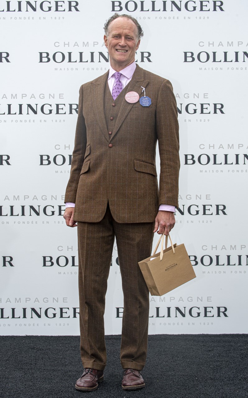 Michael Walsh from Monkstown, winner of Tuesday’s Bollinger Best Dressed award, on-stage at Punchestown. 
