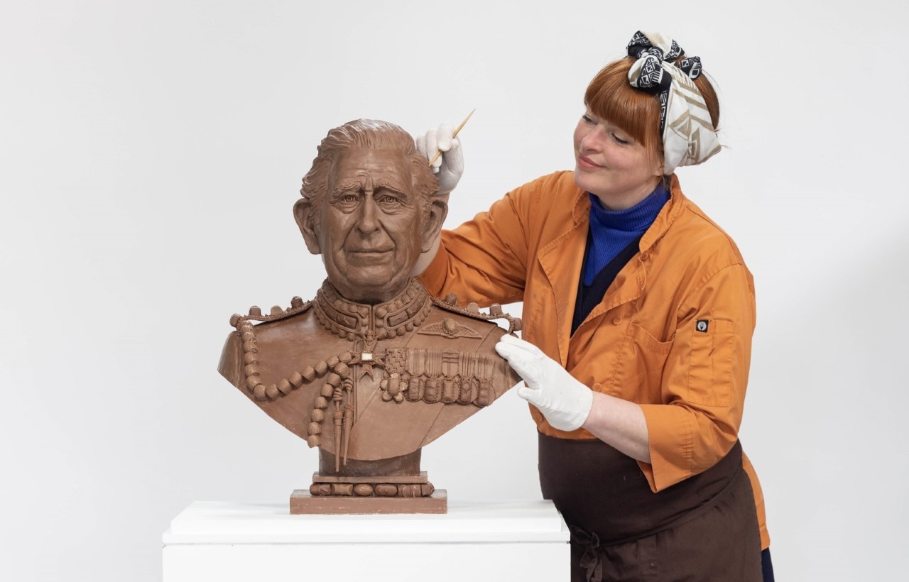 Chocolatier Jennifer Lindsey-Clarke working on the chocolate bust of Britain's King Charles III