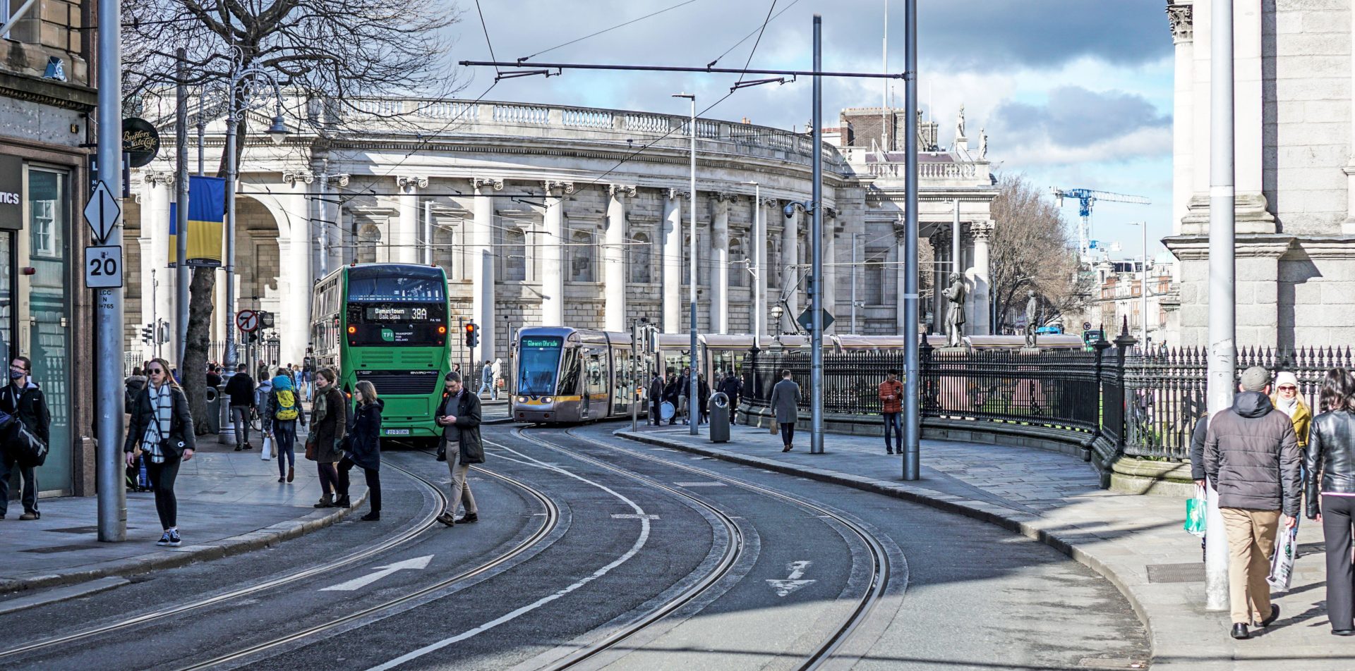The busy junction of Grafton Street and College Green, Dublin, Ireland where many forms of transport converge.