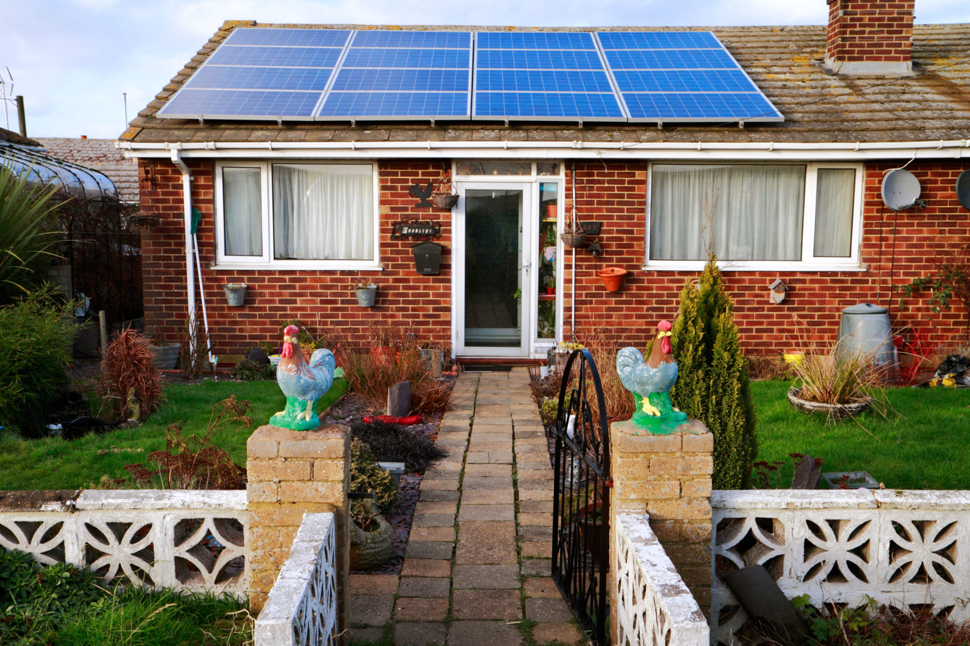 Bungalow with solar panels on roof, Leysdown, Isle of Bungalow with solar panels on roof, Leysdown, Isle of Sheppey, Kent, UKSheppey, Kent, UK