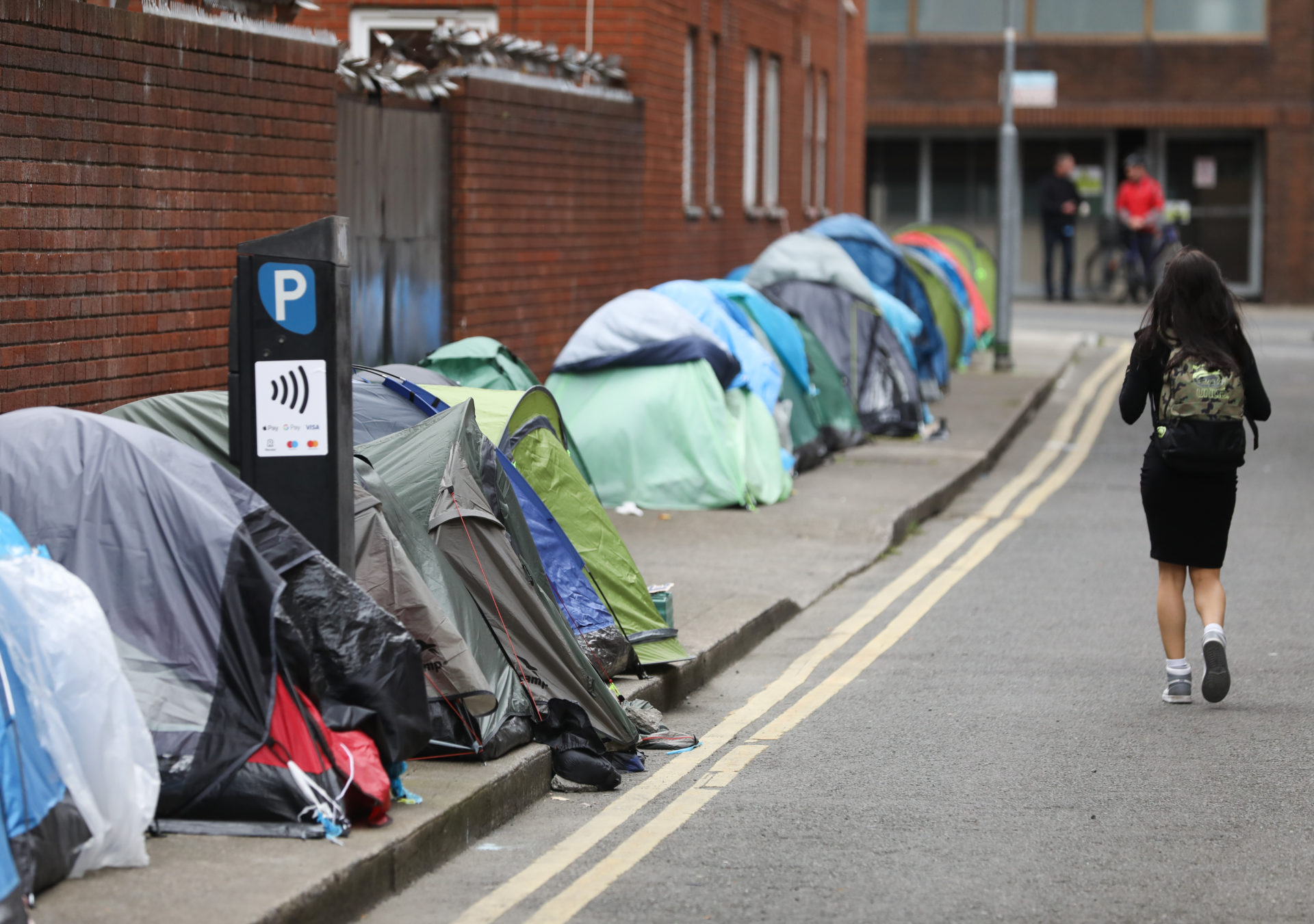 16/05/2023 Dublin, Ireland. Pictured are tents outside the International Protection Office on Mount Street. Asylum seekers who have not been provided with accomodation have pitched their tents here in protest. Tents belonging to homeless refugees were burned last night at a makeshift camp in Dublin, near the International Protection Offices. Photograph: Sasko Lazarov / © RollingNews.ie
