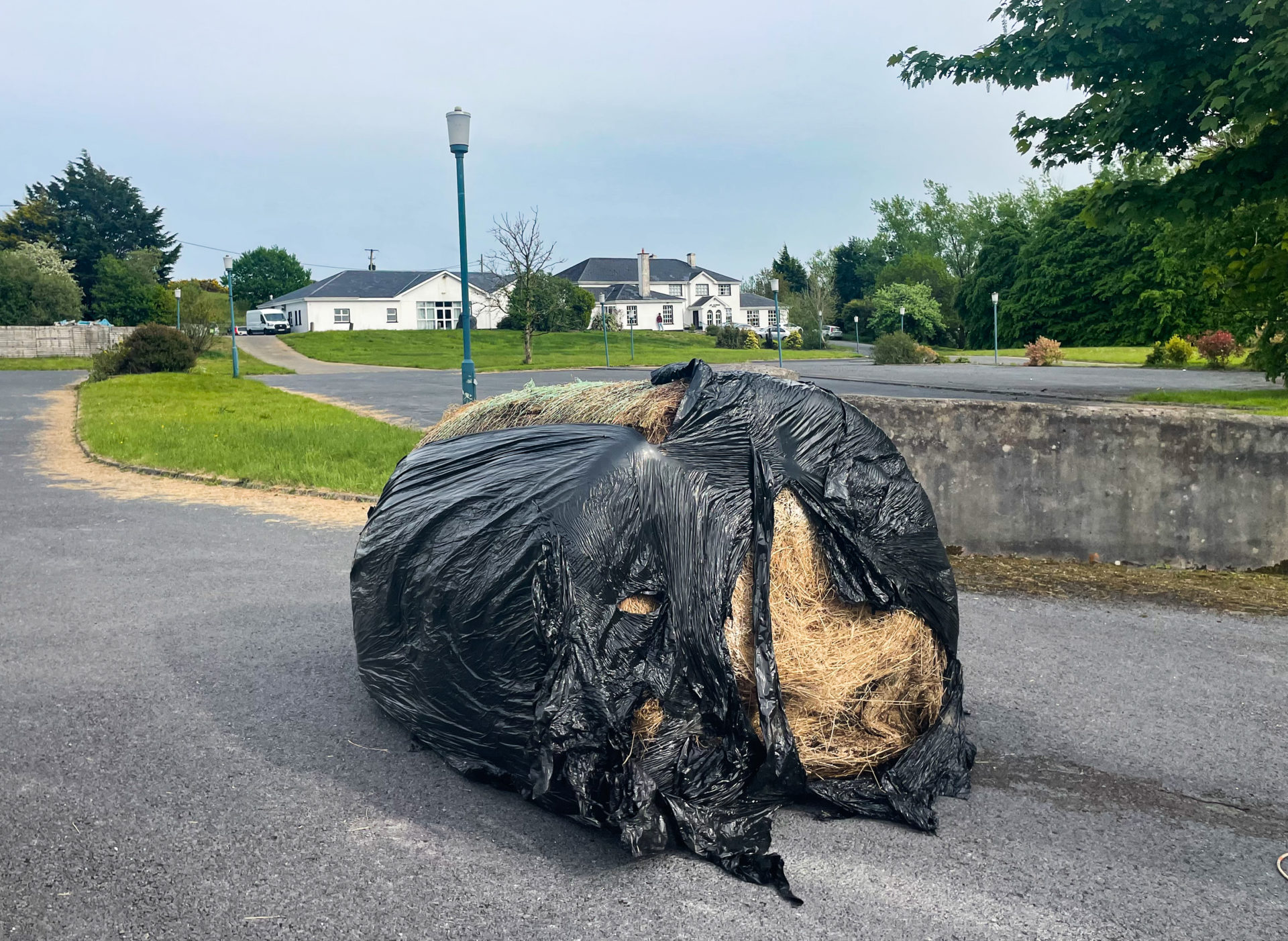 Pictured is a bale of hay blocking the entrance to the Magowna House Hotel and guest homes in Co. Clare. Locals have protested after refugees were housed here. 