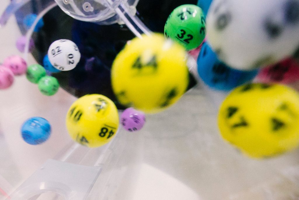 colourful lotto balls falling from the lottery machine