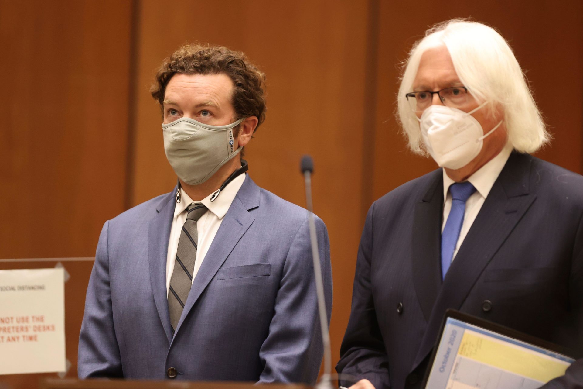 Actor Danny Masterson (left) stands with his attorney, Thomas Mesereau, as he is arraigned on rape charges at Los Angeles Superior Court in California in September 2020. 