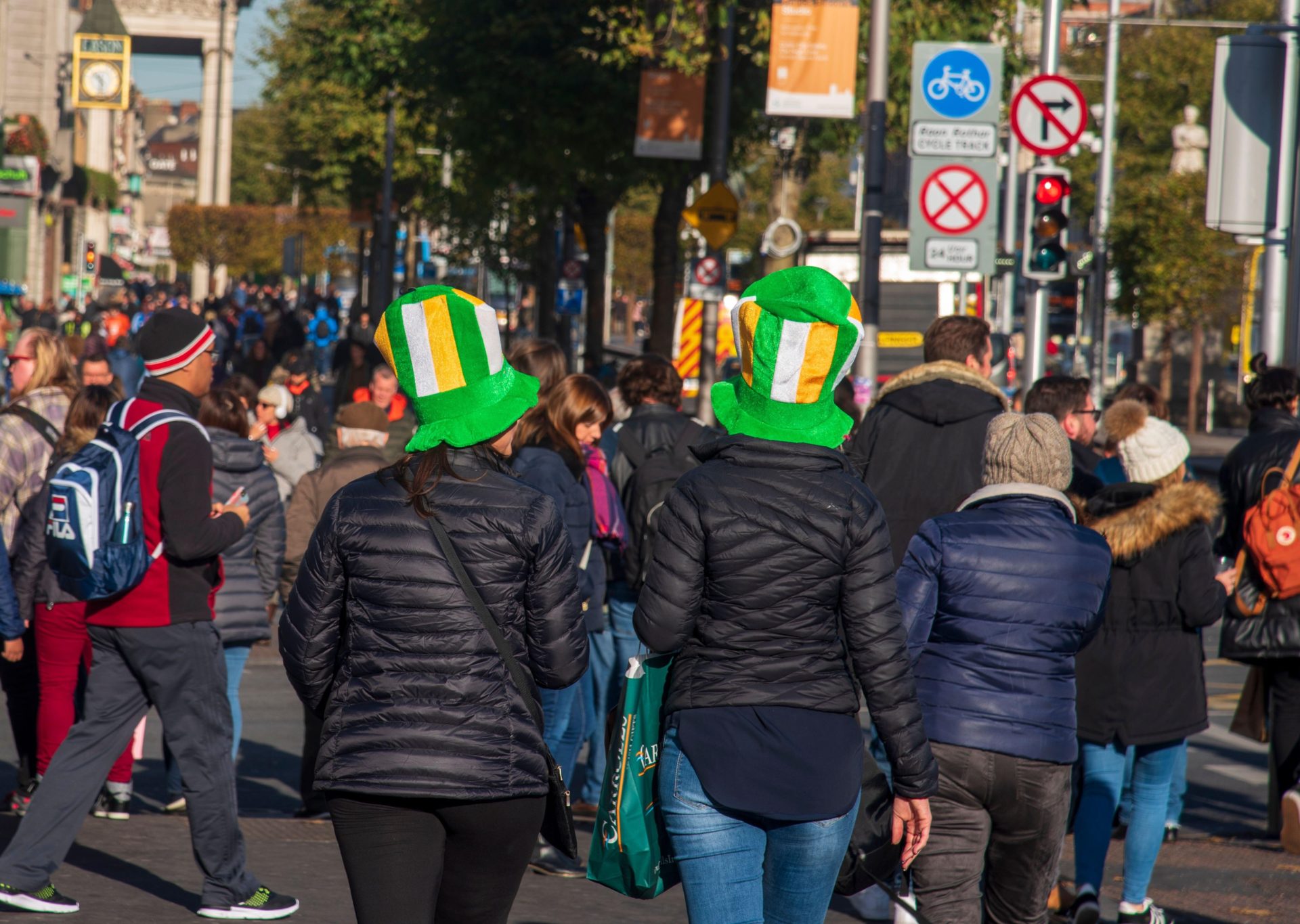 Tourists in Dublin wearing Irish Tricolour top hats in November 2018.