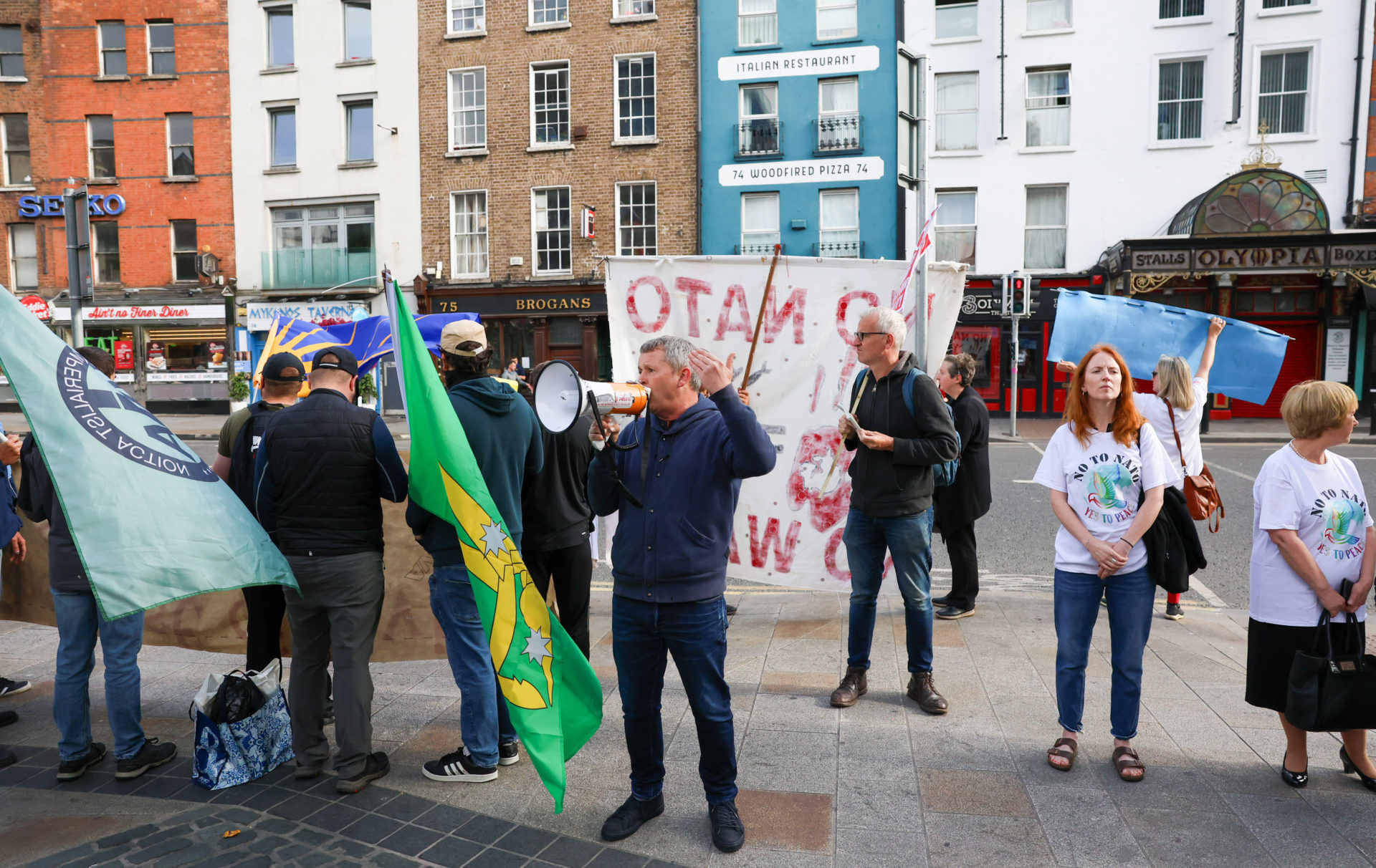 People Before Profit TD Richard Boyd Barrett addresses protesters outside Dublin Castle, where the government's Consultative Forum on International Policy is taking place,