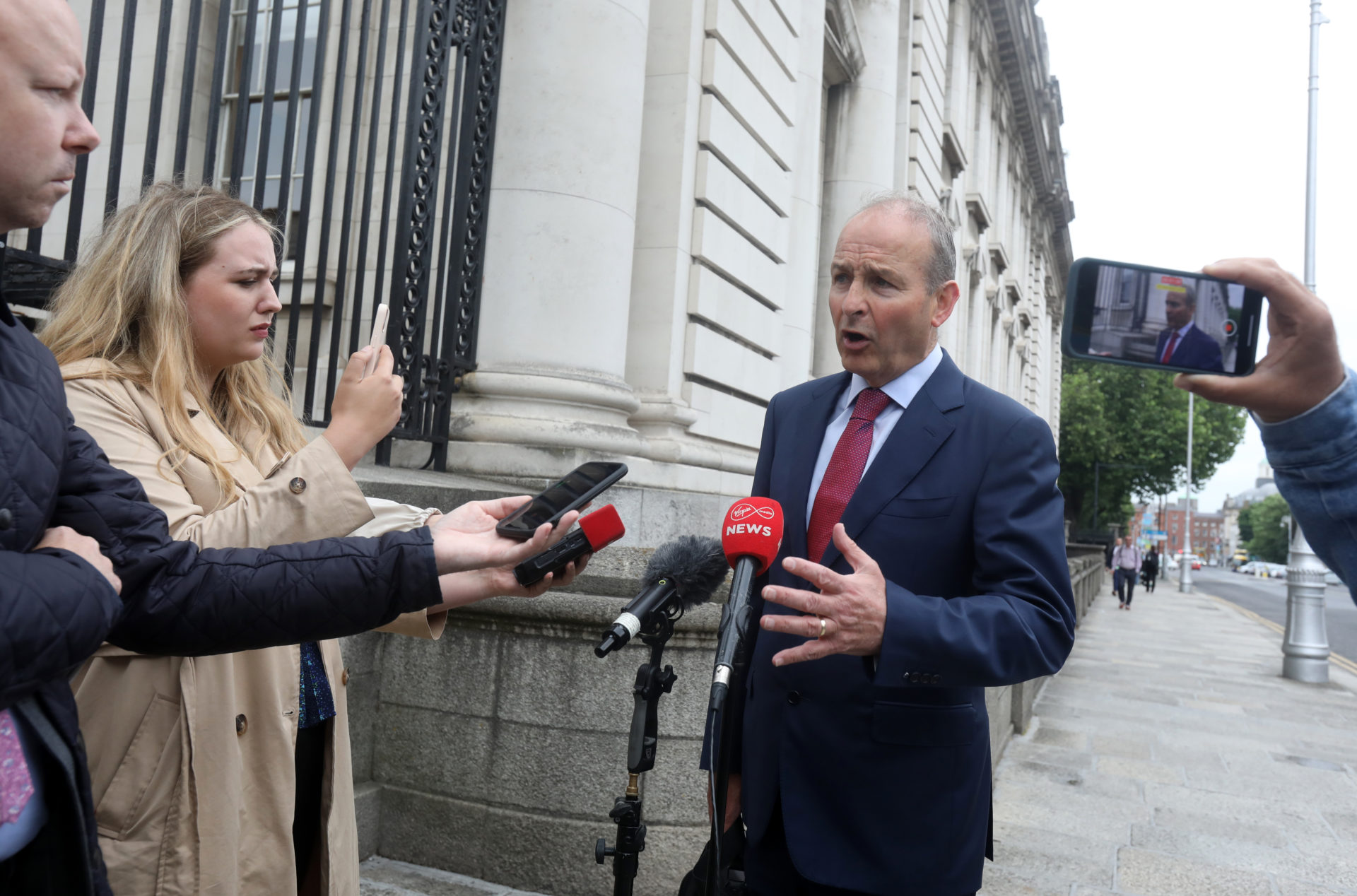 The Tánaiste and Minister for Foreign Affairs Micheál arriving for today's Cabinet meeting at Government Buildings.