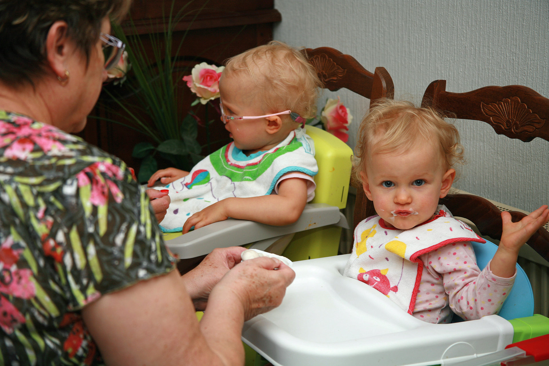 Children being fed by a childminder.