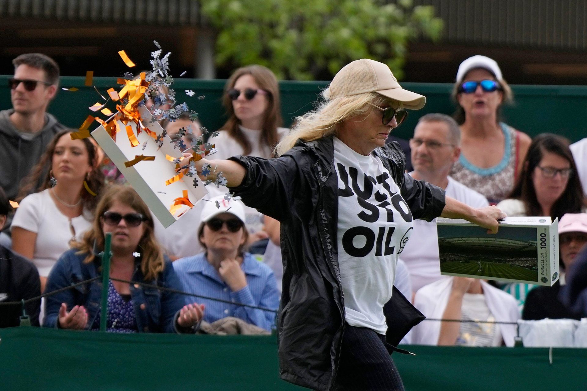 A Just Stop Oil protester runs onto Court 18 at the Wimbledon tennis championships in London, England and releases confetti