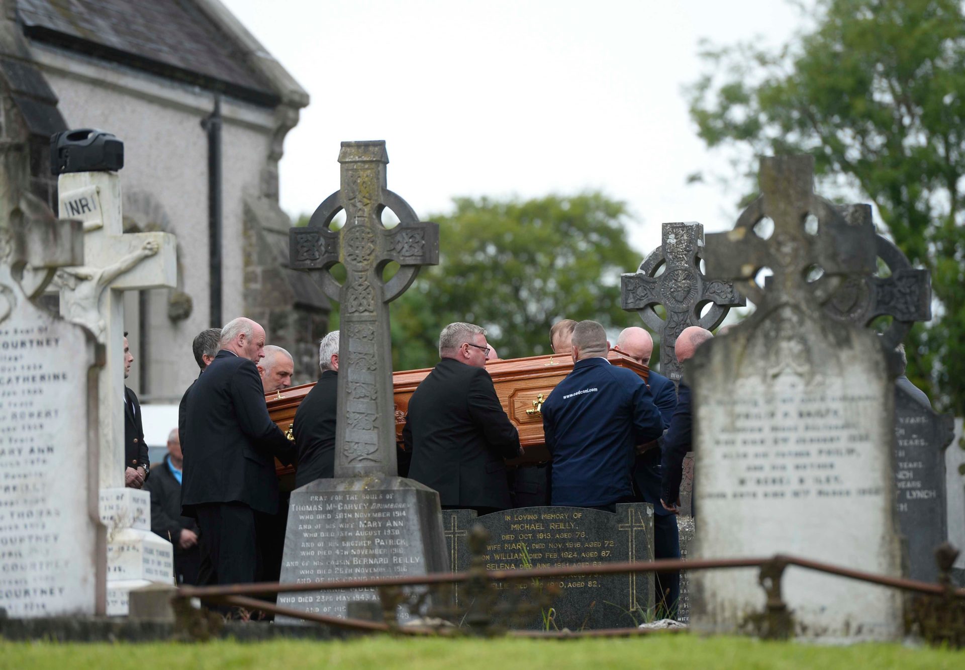 The coffin of Daire Maguire is carried from the Church of the Immaculate Conception, in Newtownbutler, County Fermanagh following his funeral