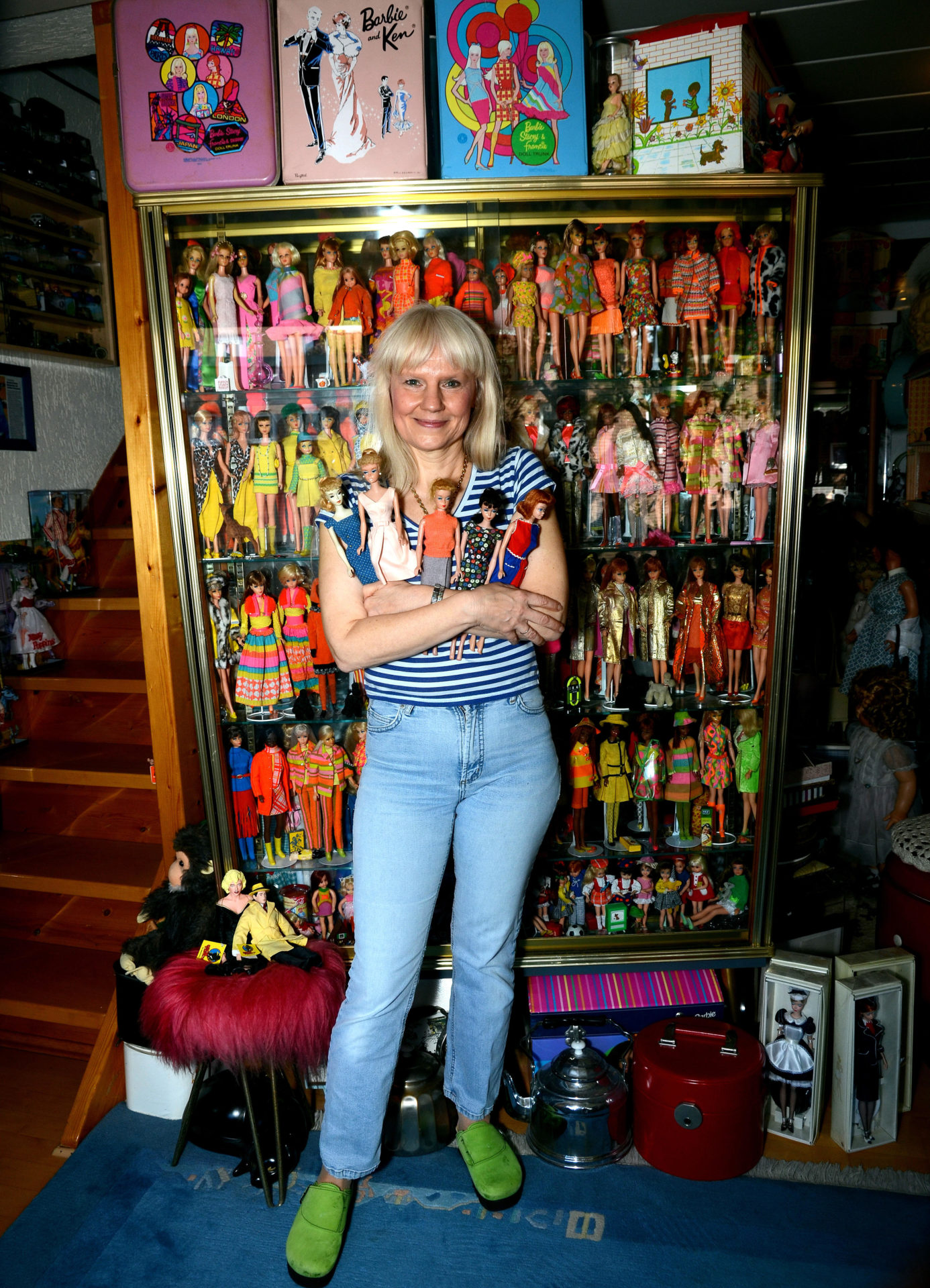Barbie doll collector Bettina Dorfmann poses before her Barbie collection Duesseldorf, Germany in September 2014. 