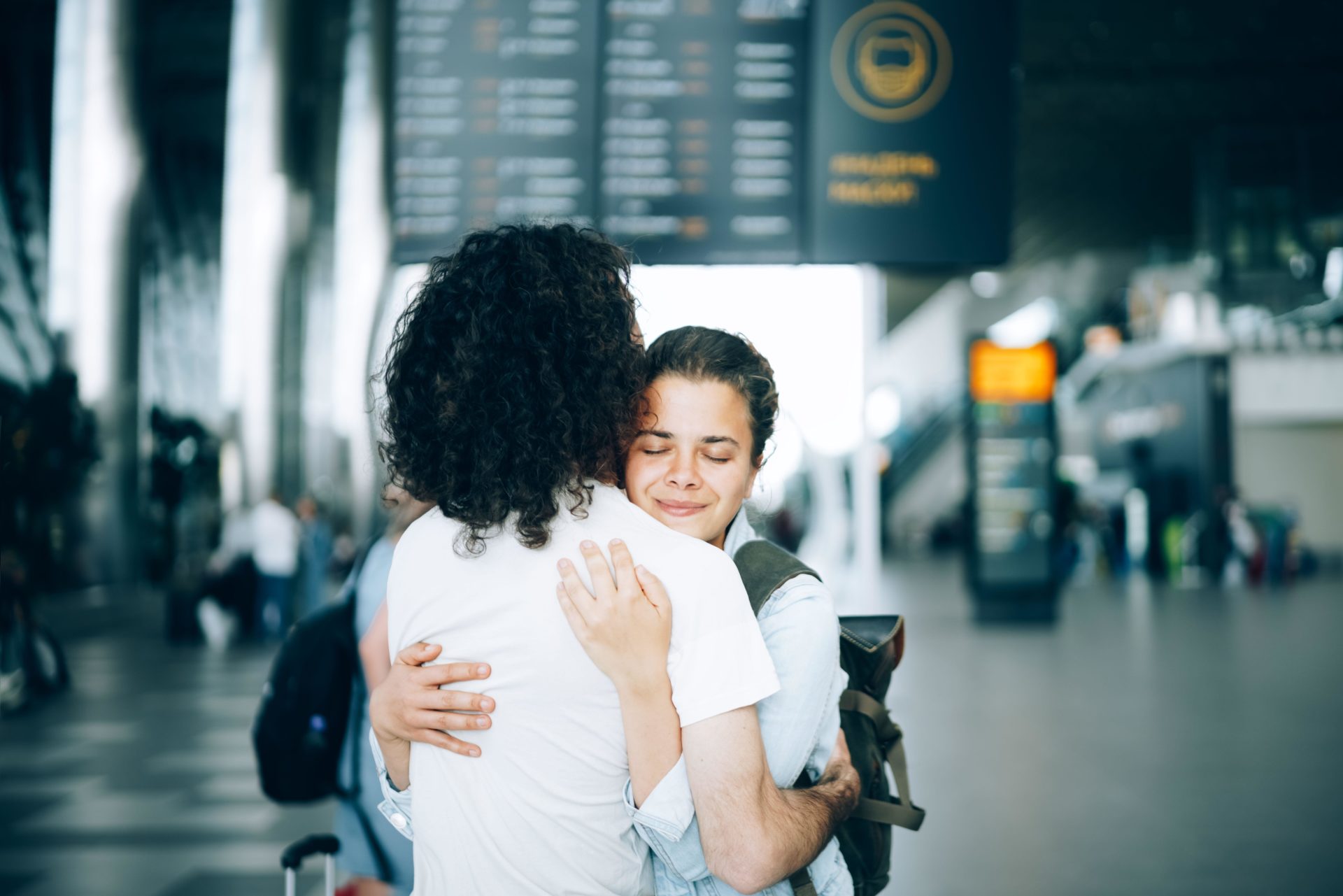 Couple saying goodbye to each other at the airport. Image:  Yana Iskayeva / Alamy Stock Photo 