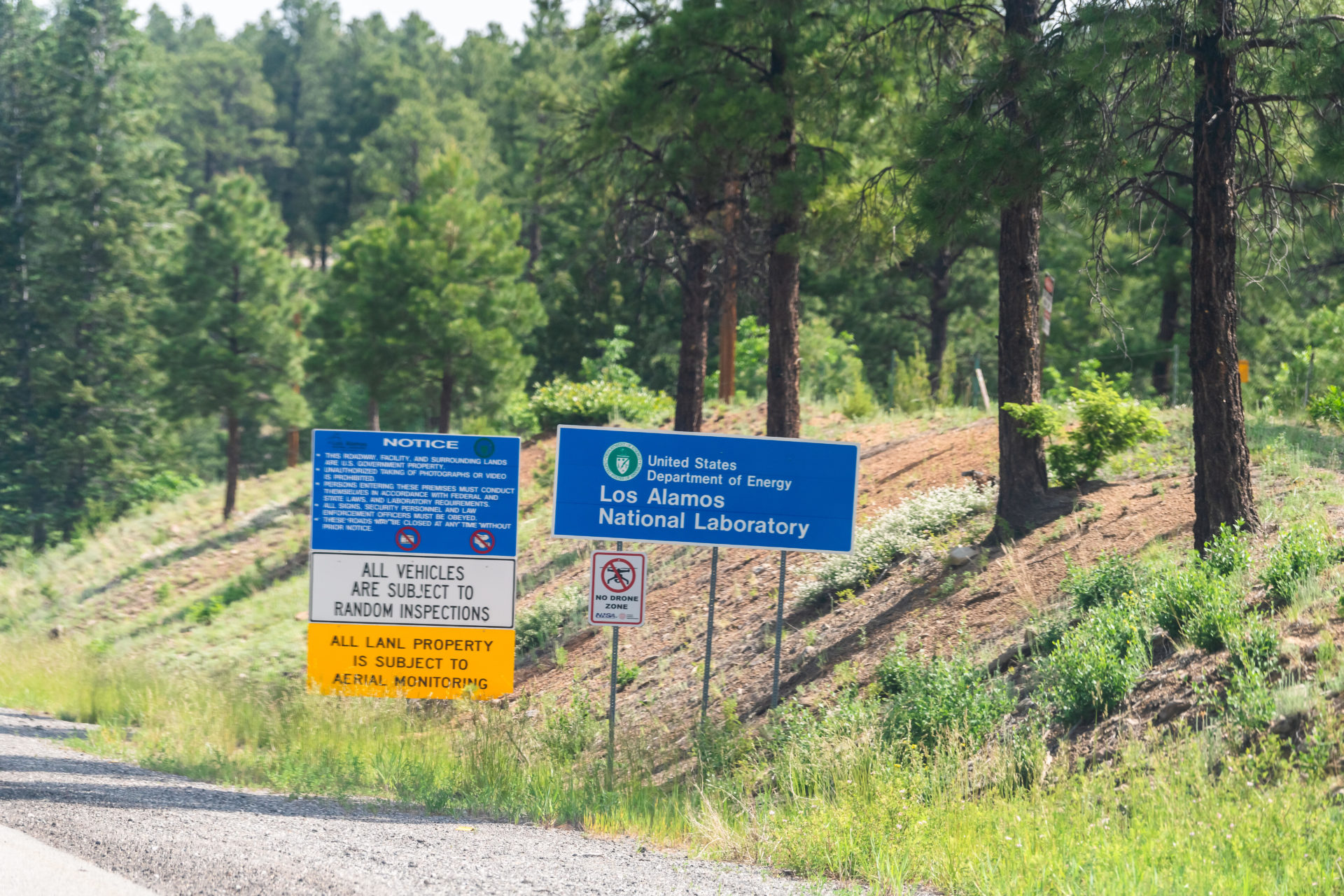 W8WDY1 Los Alamos, USA - June 17, 2019: Road in New Mexico on highway street with sign for National Laboratory and Department of Energy