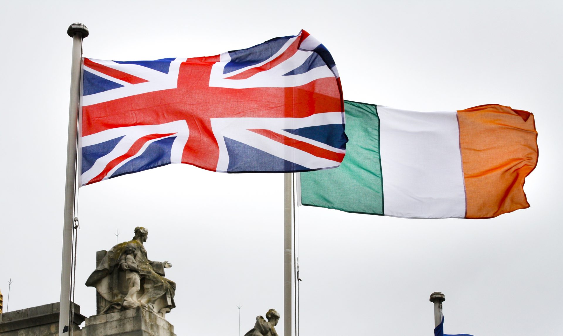 A British flag flies next to an Irish Tricolour at Government Buildings in Dublin during the State visit of Britain's Queen Elizabeth II to Ireland in May 2011