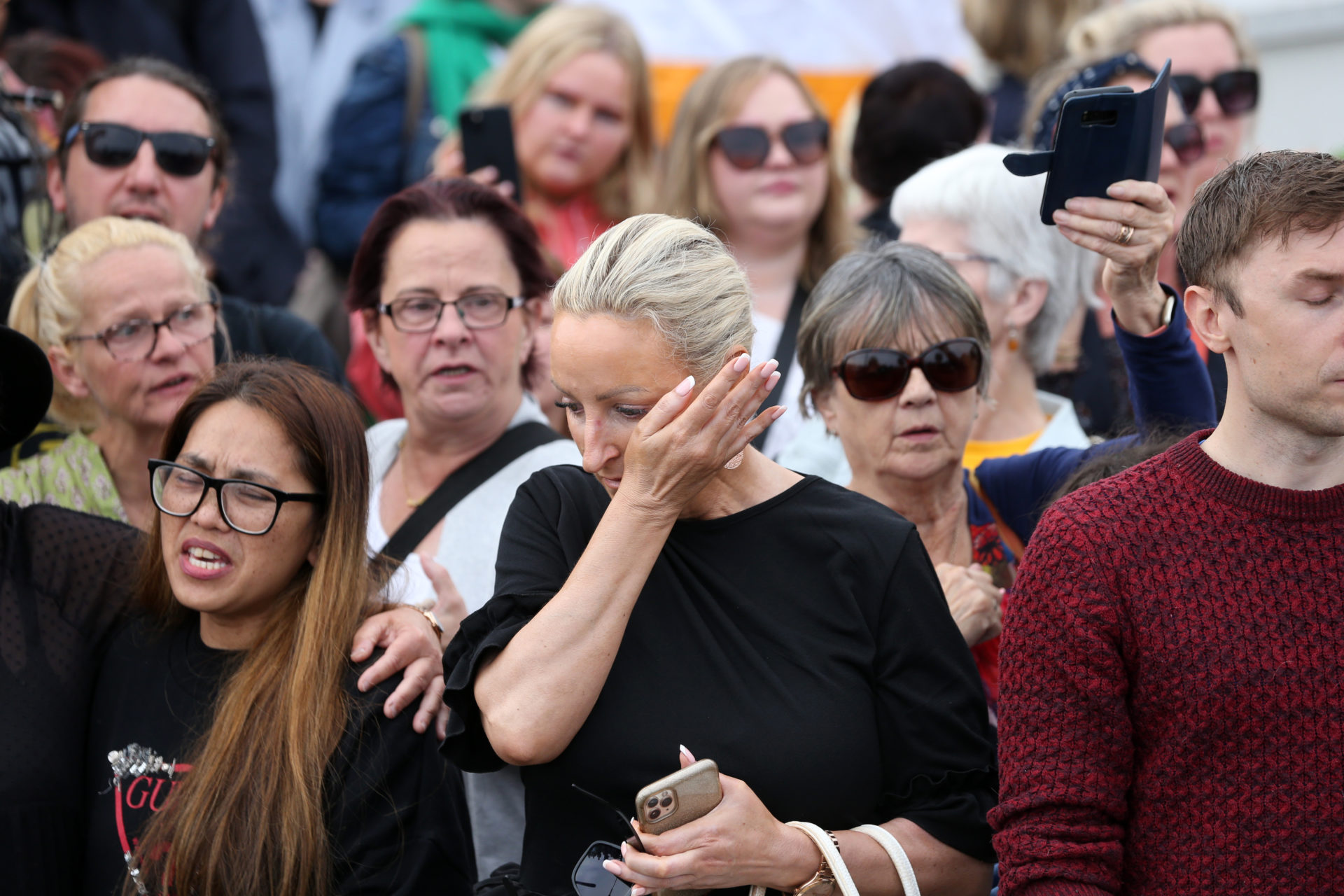 Upset and emotion in the crowd as people gather to say their goodbyes to Sinéad O’Connor