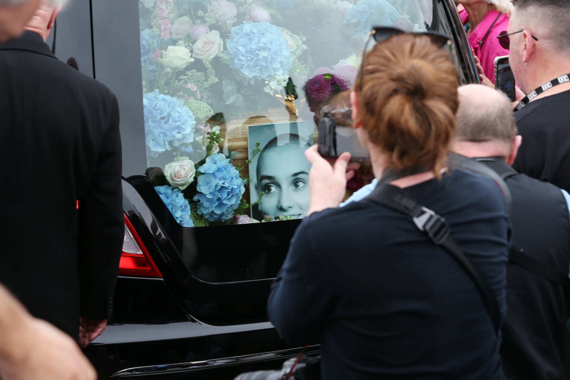 The hearse carrying Sinead O'Connor's body passes by crowds of well-wishers and mourners lining the Bray seafront ahead of her funeral
