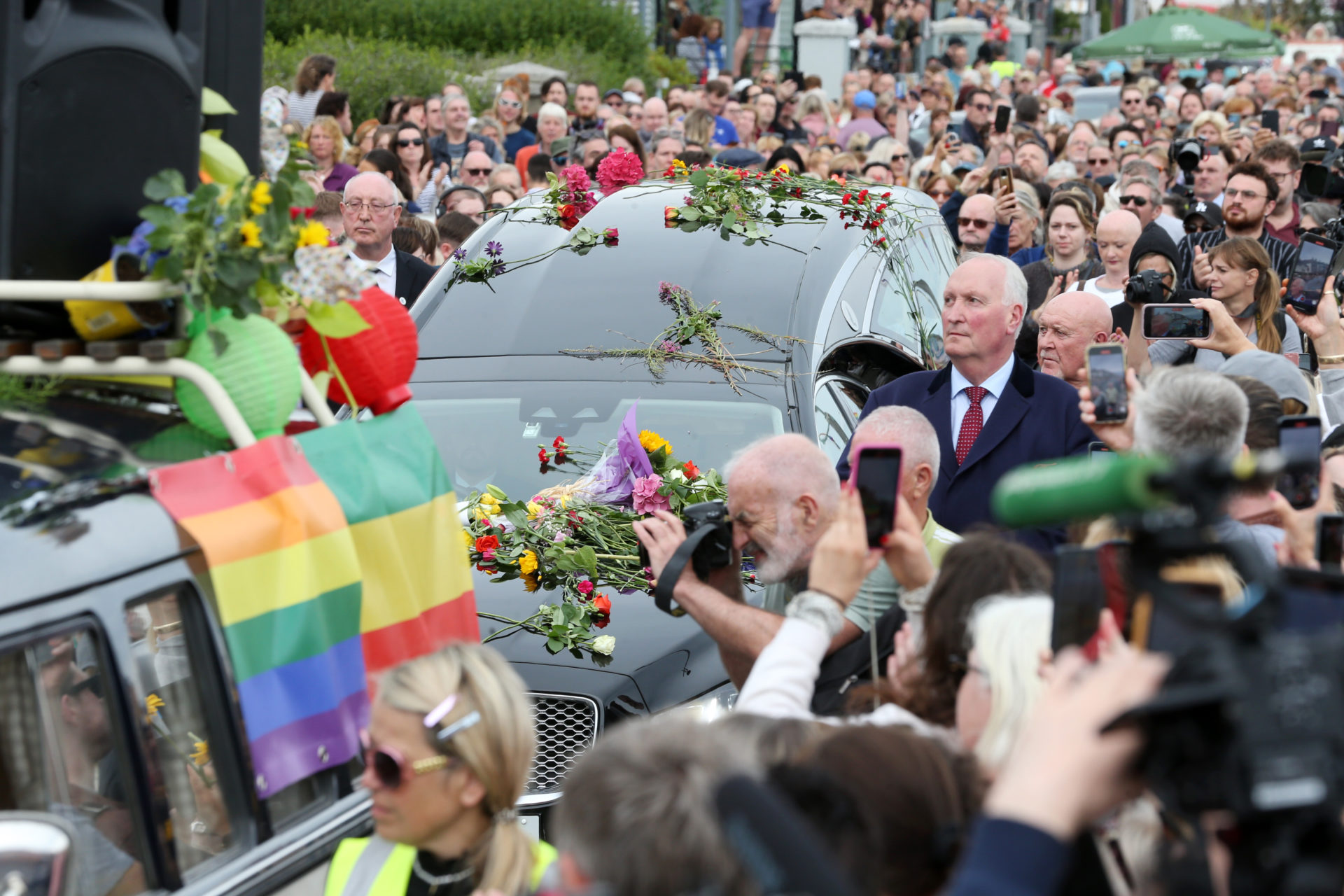 The hearse carrying Sinead O'Connor's body passes by crowds of well-wishers and mourners lining the Bray seafront ahead of her funeral