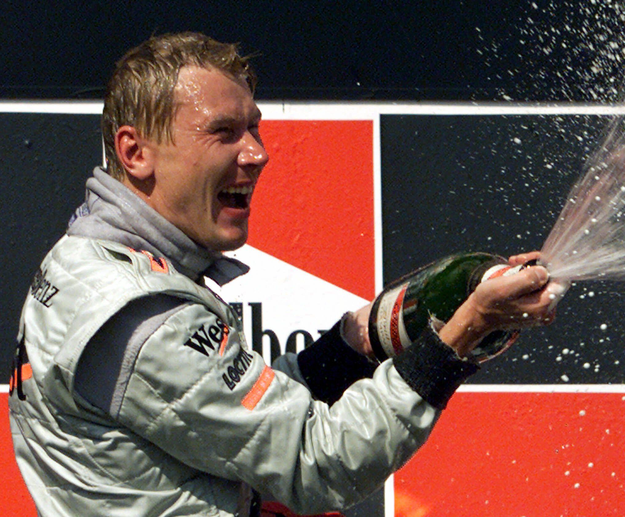 Mika Häkkinen celebrates winning the F1 Hungarian Grand Prix. Image: Associated Press / Alamy 