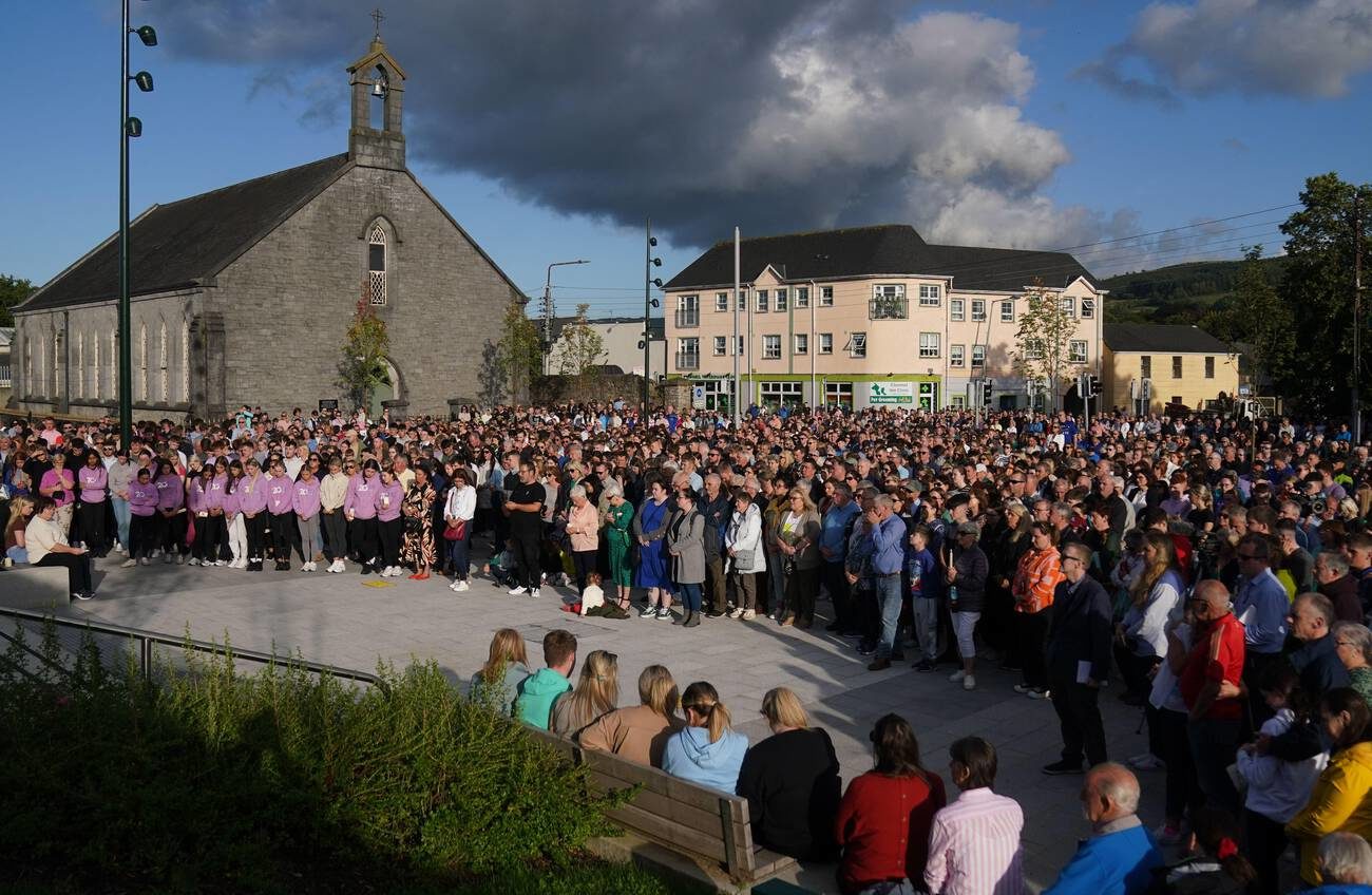 2RMAYRR 2RMAYRR People attend a vigil in Kickham Plaza, Co Tipperary, in memory of Luke McSweeney, 24, his 18-year-old sister Grace McSweeney, Zoey Coffey and Nicole Murphy, both also 18, who died while on the way to celebrate exam results after the car they were travelling in struck a wall and overturned in Clonmel on Friday. Picture date: Sunday August 27, 2023.