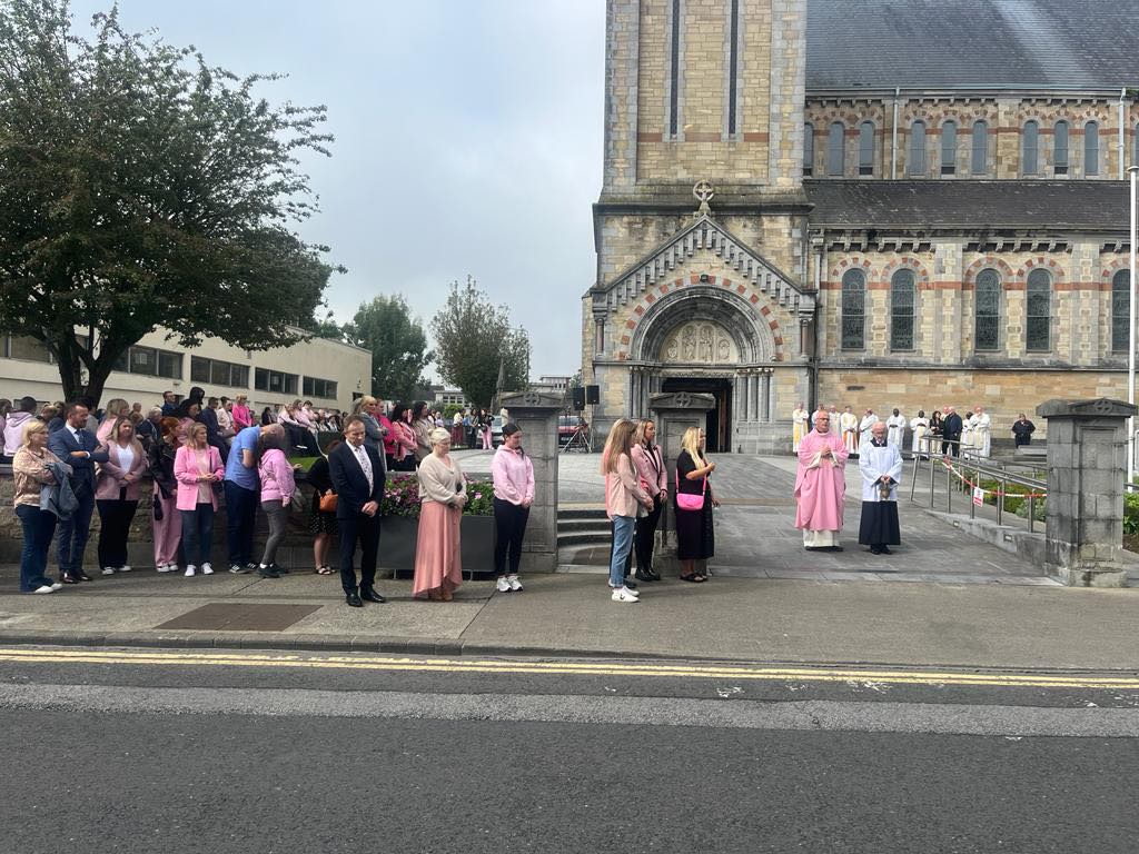 Mourners gather outside St. Peter and Paul’s Church in Clonmel for the funeral of Zoey Coffey, dressed in pink.