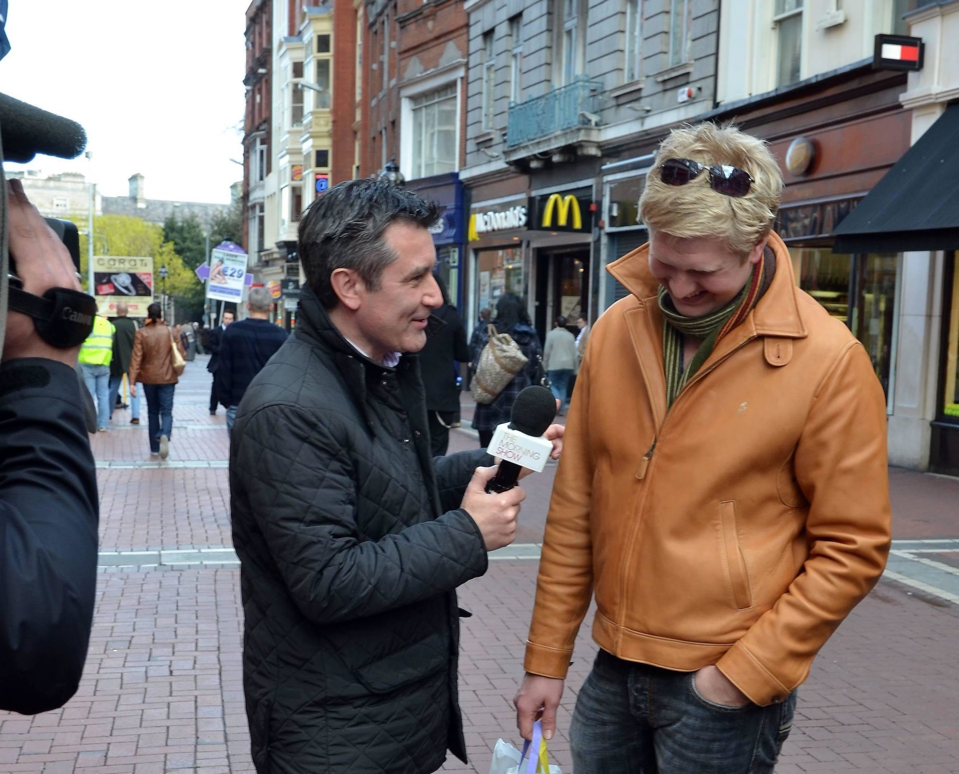 Martin King interviewing shoppers on Grafton Street Dublin. 30.03.11.