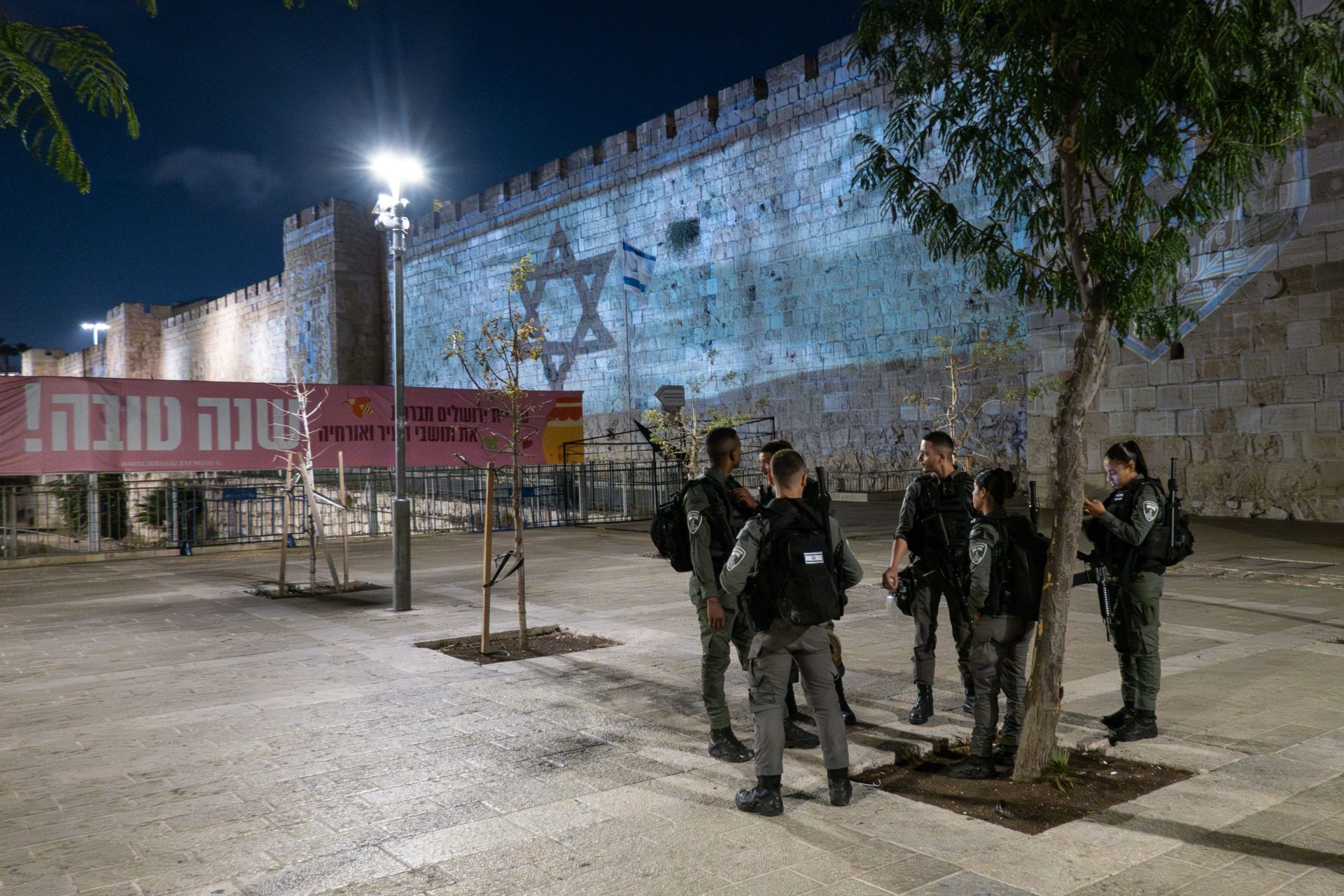 The Israeli flag is projected on the walls of Jerusalem's Old City near the Jaffa Gate following the Hamas attack