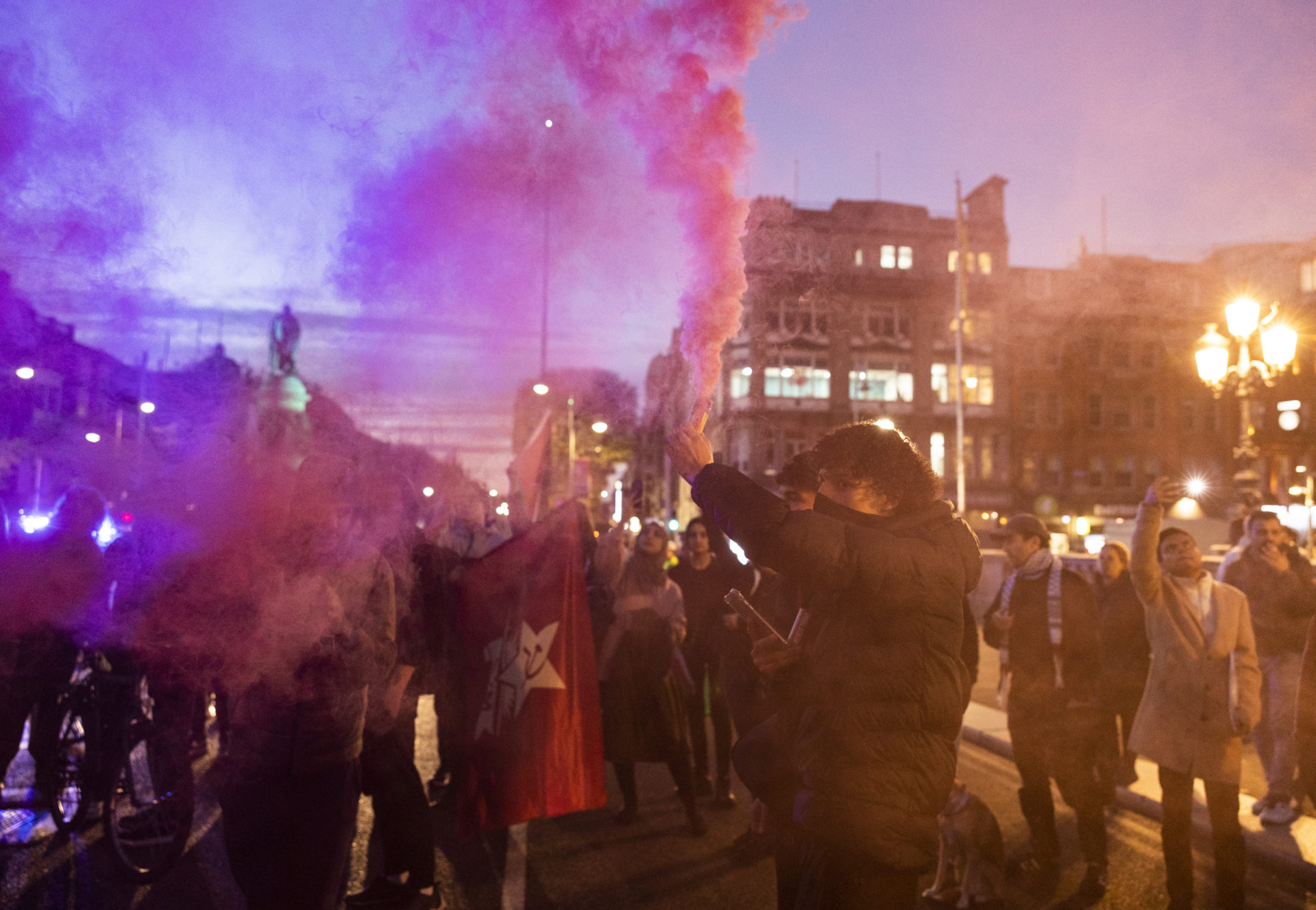 Protesters march with flares in Dublin city centre at a 'Stand with Palestine' rally on October 11th 2023, as the Israel–Hamas war continues.