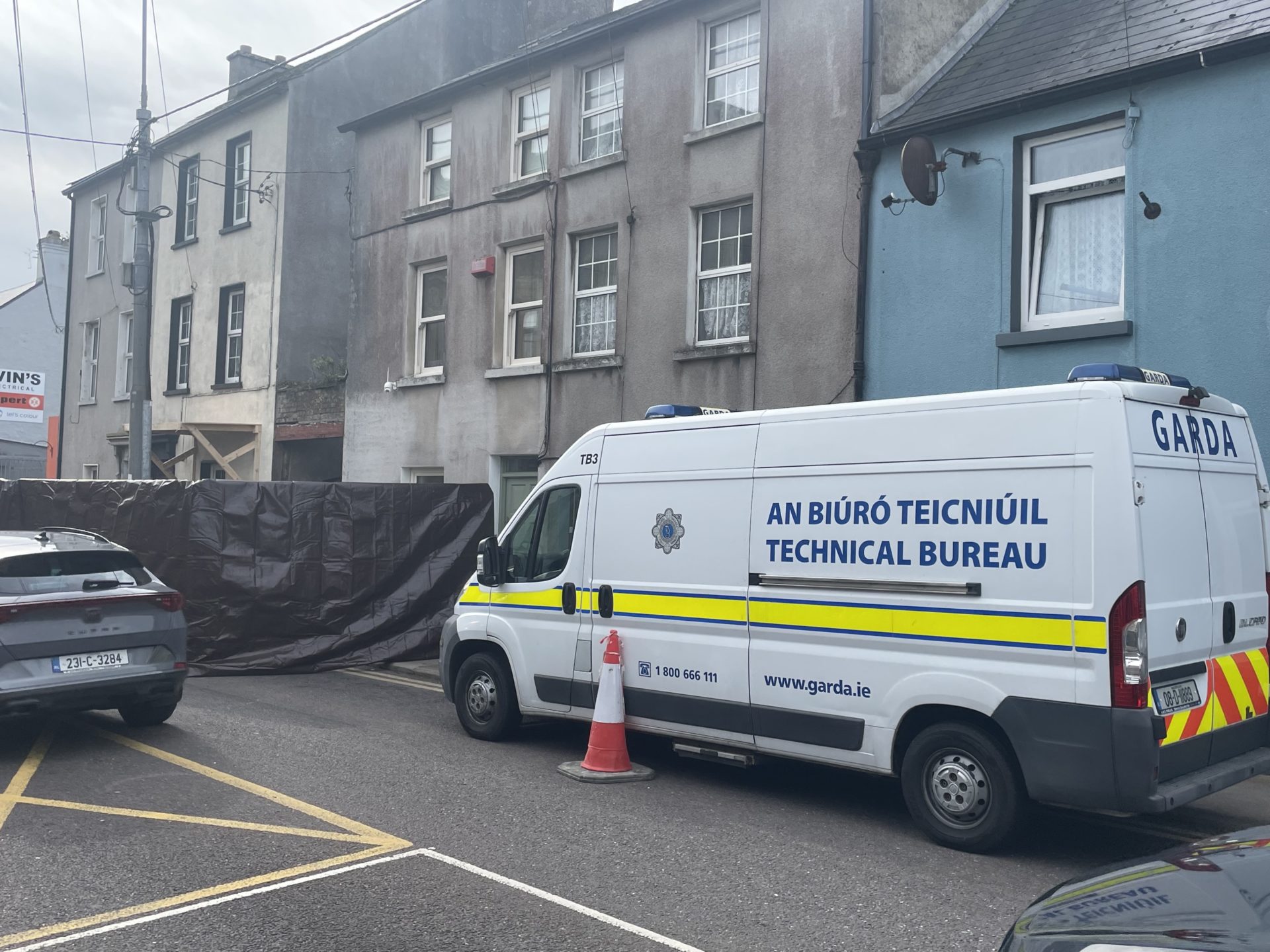 Gardaí outside the house where Tina Satchwell lived in Youghal, County Cork.