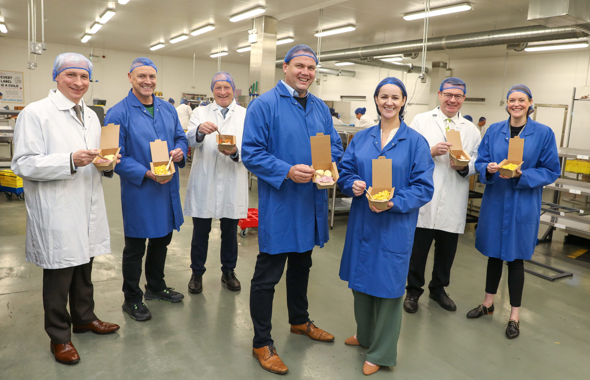 Politicians and staff at the announcement of The Lunch Bag expansion.