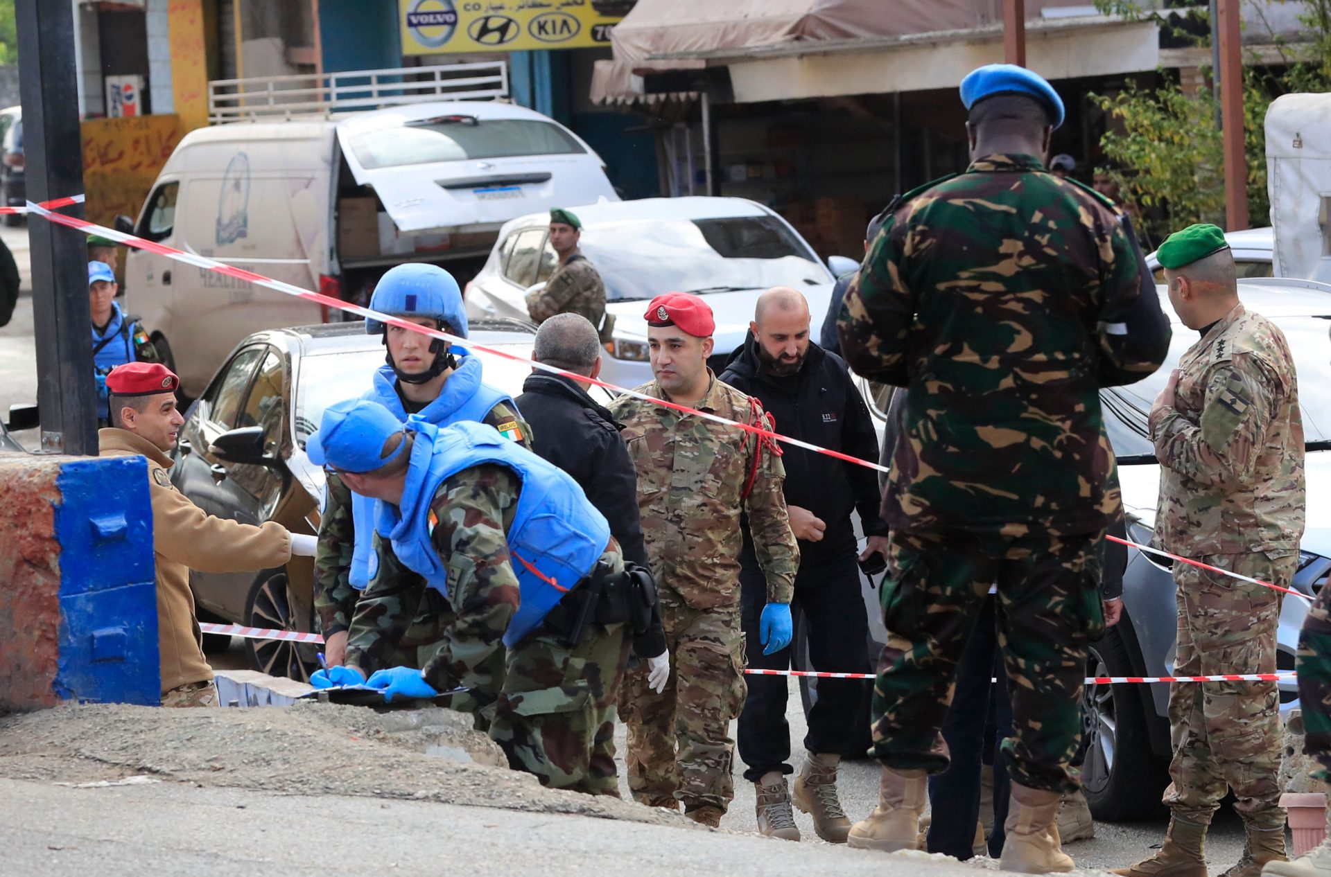 2M7DW14 Irish UN peacekeepers and Lebanese soldiers investigate the scene where gunfire came on a UN peacekeeper convoy in the Al-Aqbiya village, south Lebanon, Thursday, Dec. 15, 2022. (AP Photo/Mohammed Zaatari)